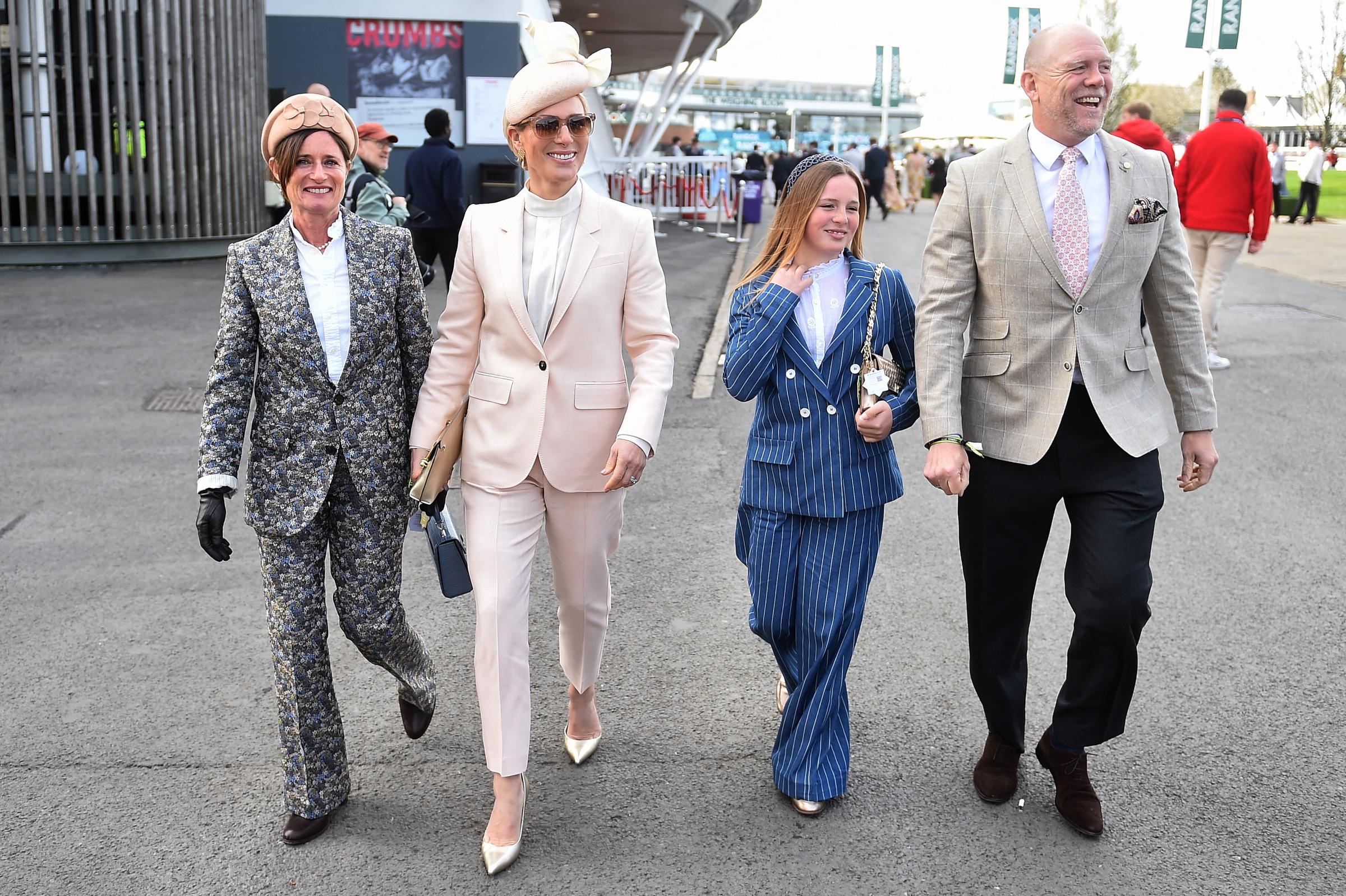 The trio were later seen walking through the racecourse grounds, with Zara Tindall and Mia Tindall subtly coordinating their tailored looks &mdash; Zara in soft pastel pink and Mia in structured blue stripes &mdash; as Mike Tindall kept pace beside them in a neutral-toned blazer, the family exuding effortless style in motion.