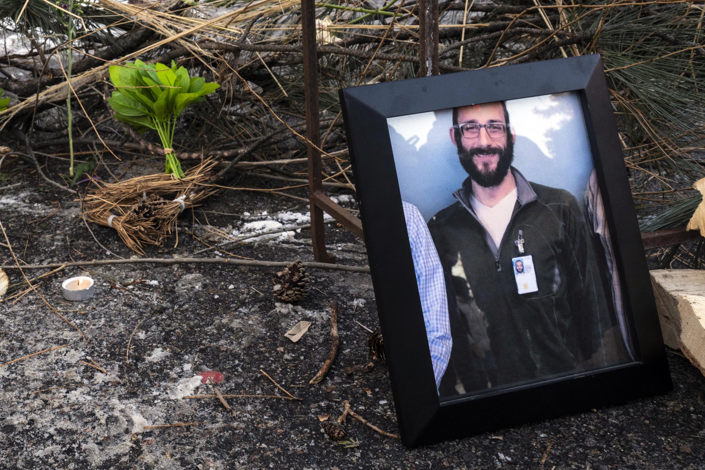 A framed photo of Alex Pretti is displayed at a makeshift memorial in Minneapolis | Source: Getty Images