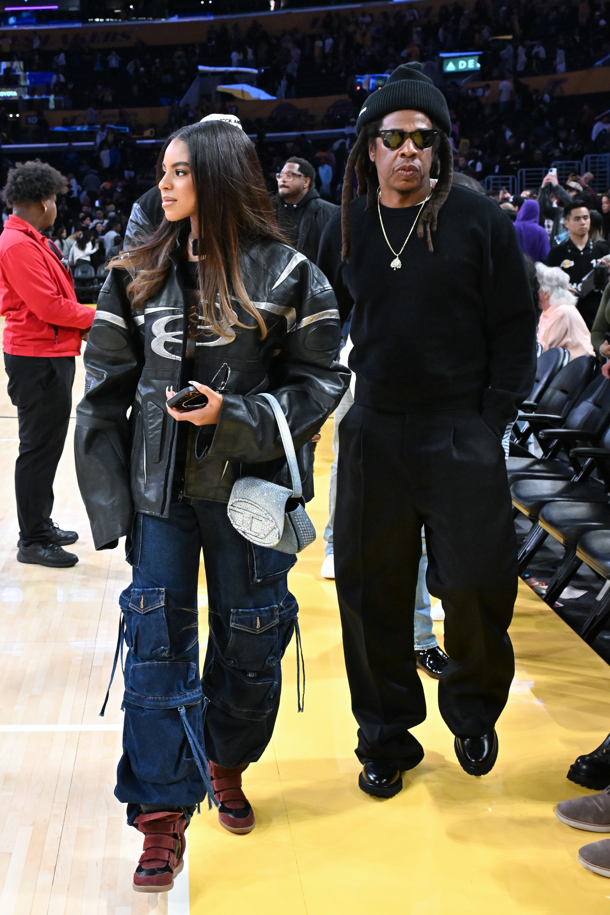 Blue Ivy Carter and Jay-Z attend a basketball game between the Los Angeles Lakers and San Antonio Spurs at Crypto.com Arena in Los Angeles, California, on December 10, 2025 | Source: Getty Images