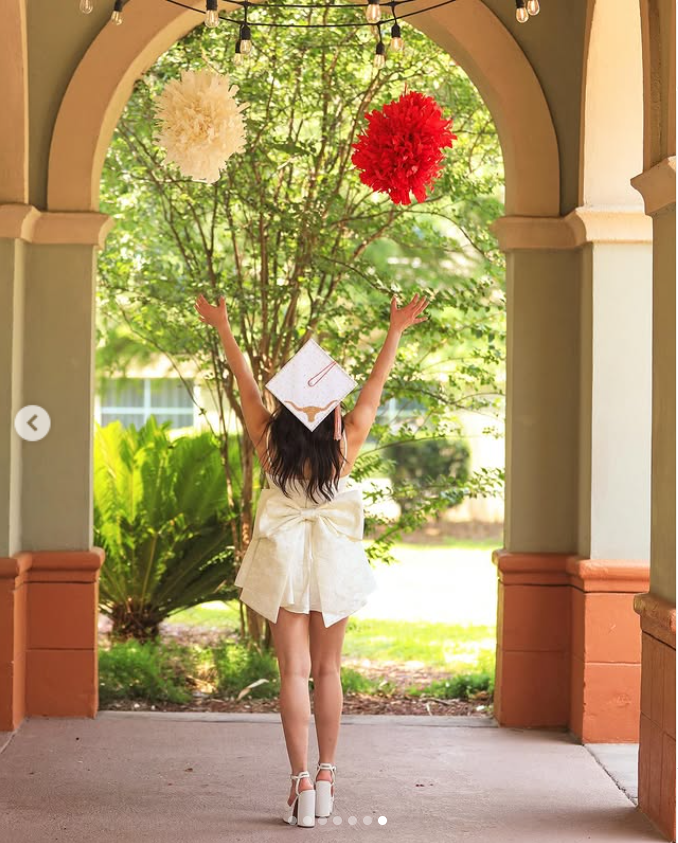 Brianna Aguilera is in her graduation dress and cap as she throws pom poms into the air, as seen from a post dated May 31, 2024. | Source: Instagram/brie.aguilera