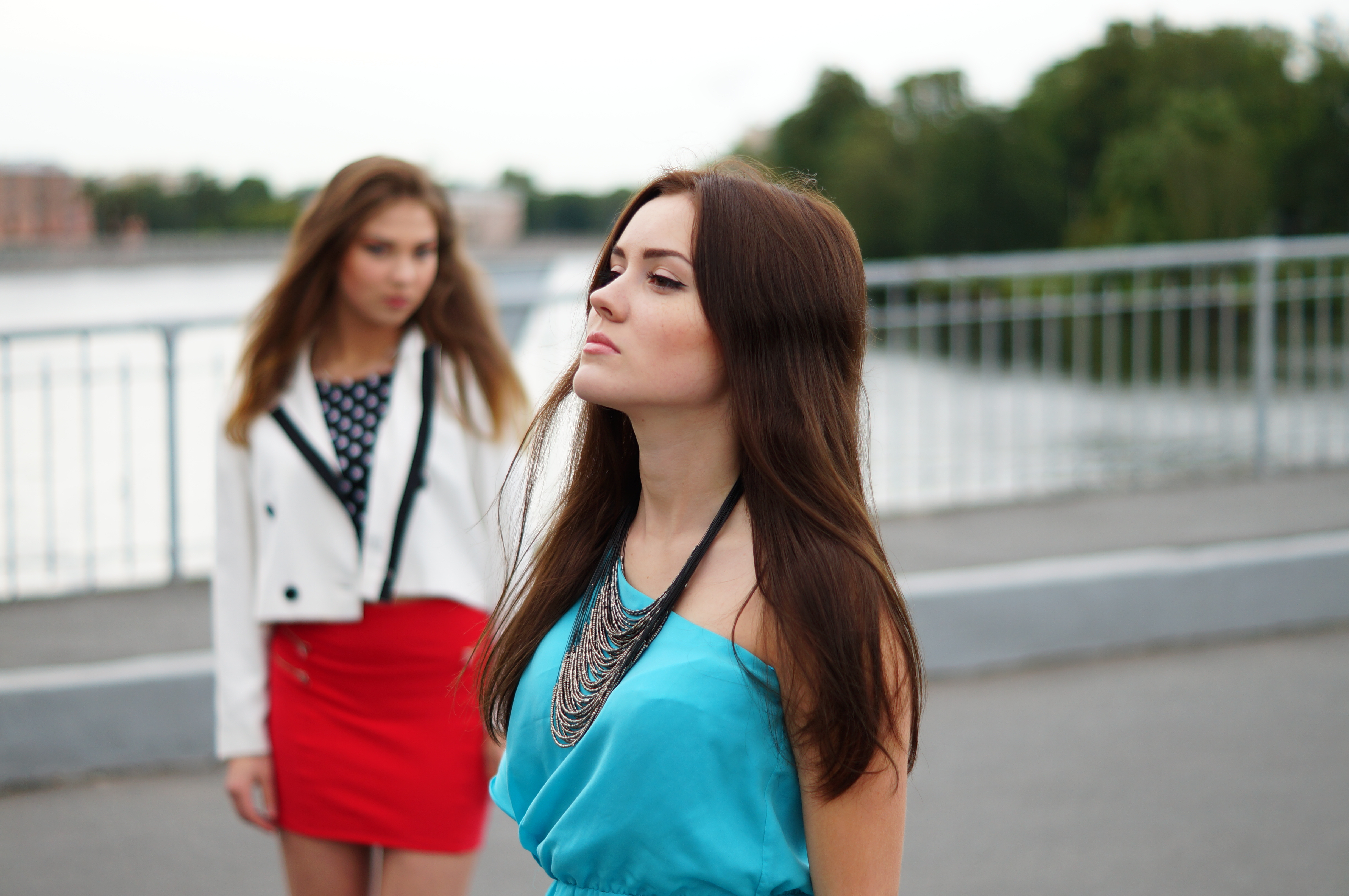 A woman looking away from an upset woman standing in the background | Source: Shutterstock