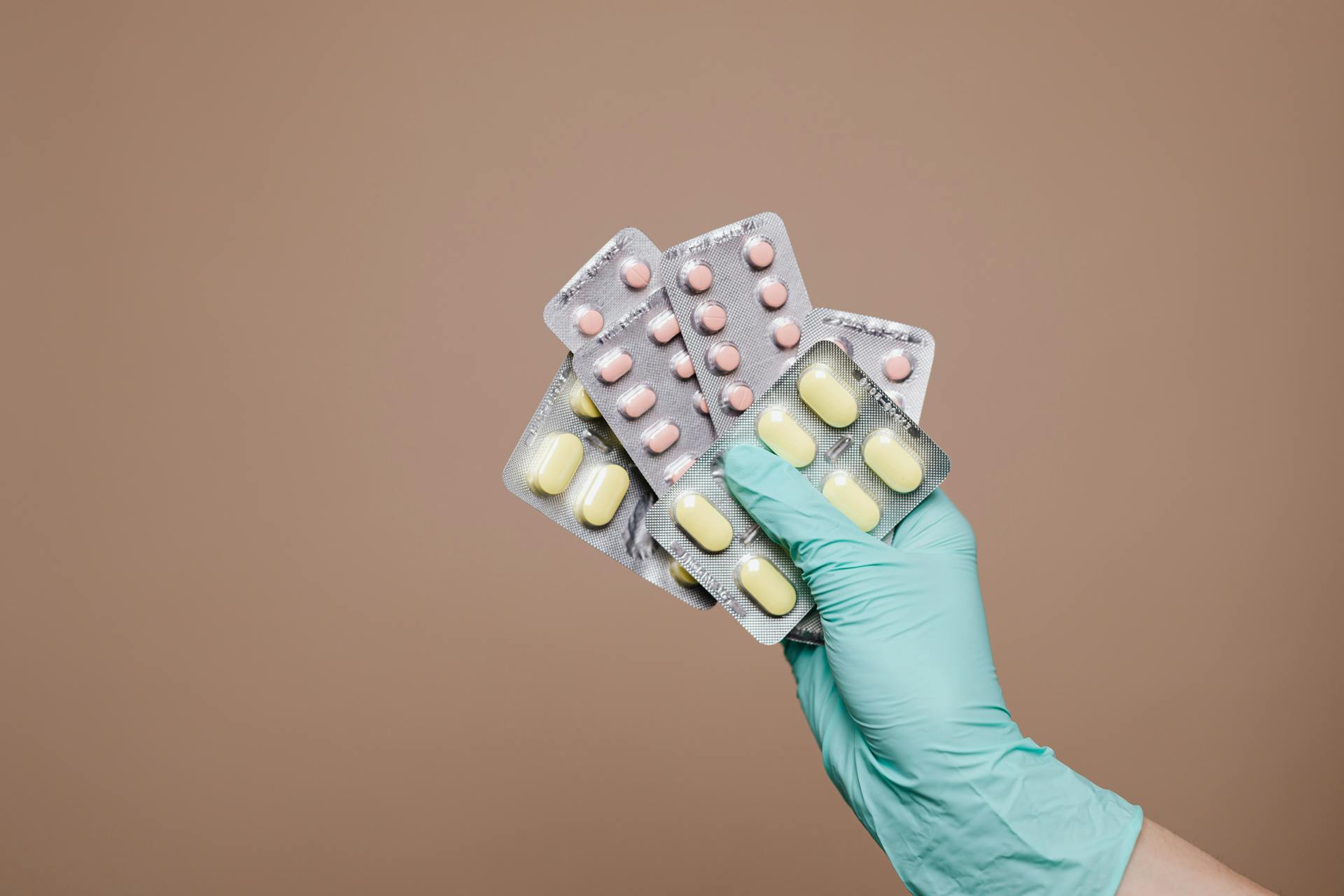 Person holding medication | Source: Pexels