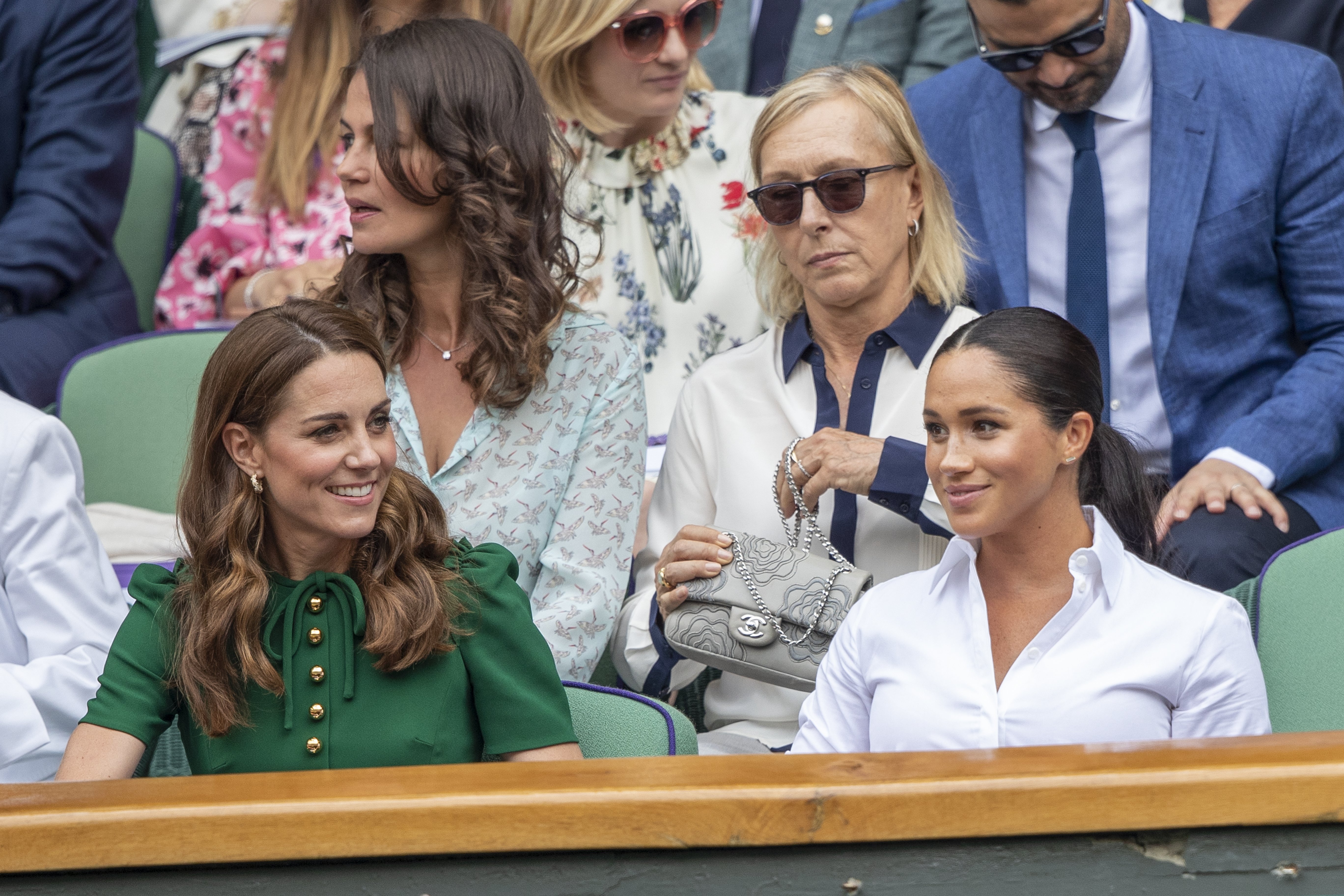 Kate Middleton and and Meghan Markle seated in the Royal Box on Centre Court during the Wimbledon Lawn Tennis Championships at the All England Lawn Tennis and Croquet Club at Wimbledon on July 13, 2019 in London, England. / Source: Getty Images
