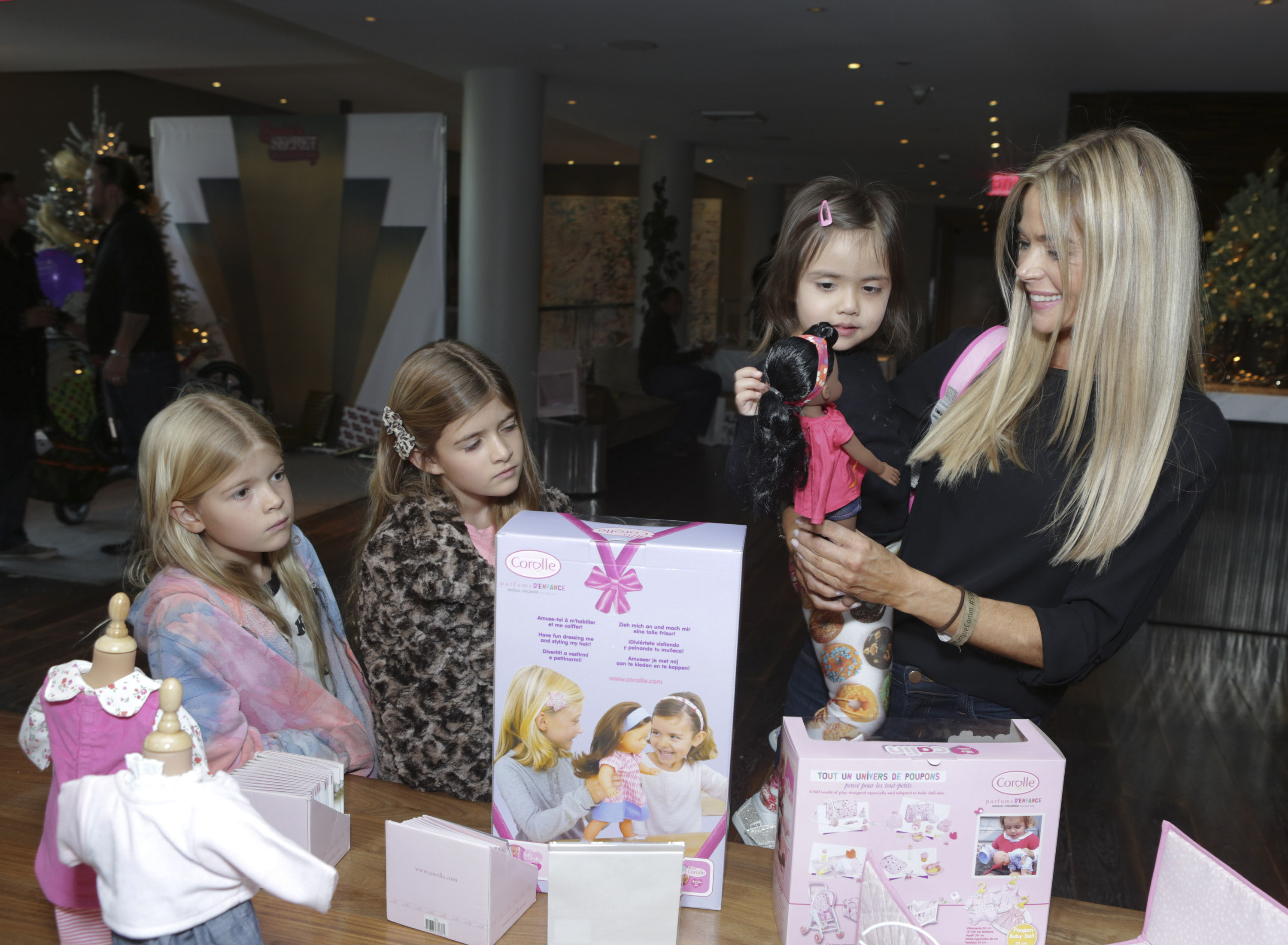 Denise Richards, Eloise Richards, Lola Sheen and Sam Sheen attend the 3rd Annual Santa's Secret Workshop Benefiting LA Family Housing at Andaz Hotel on December 7, 2013 in Los Angeles, California | Source: Getty Images