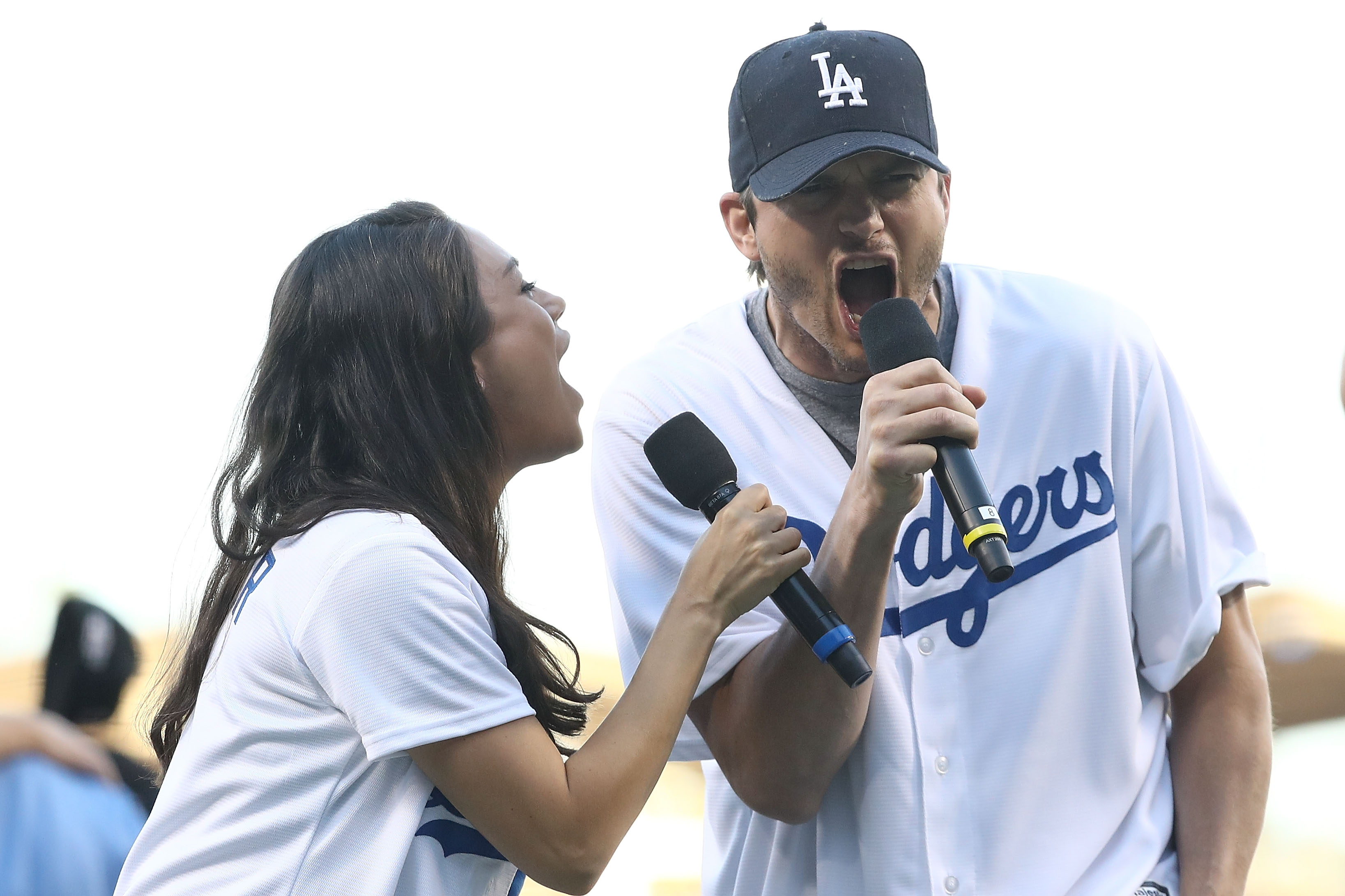 Mila Kunis and Ashton Kutcher announce the Los Angeles Dodgers starting lineup prior to game 4 of the NLCS between the Chicago Cubs and the Los Angeles Dodgers on October 19, 2016 | Source: Getty Images