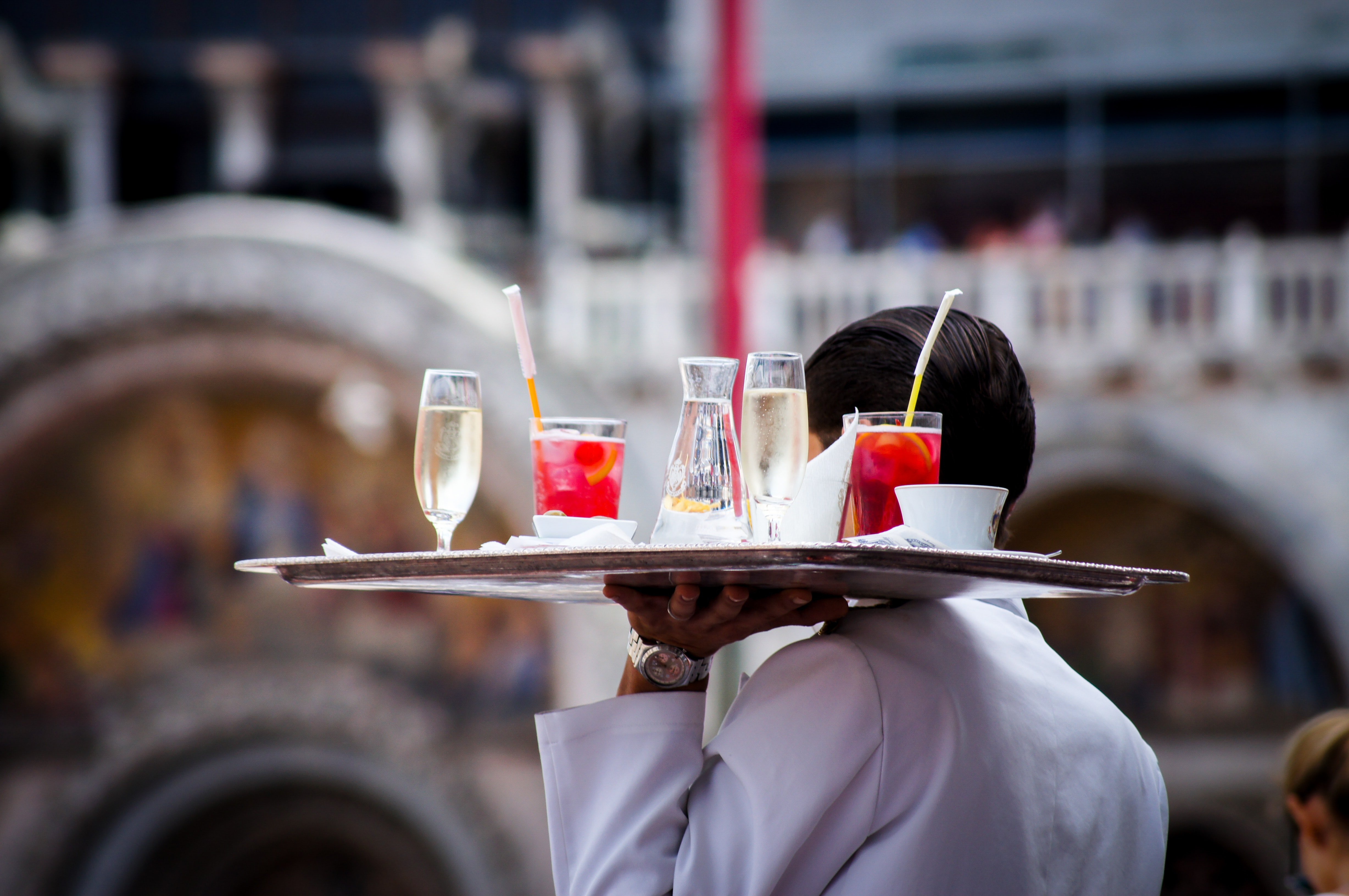 Waiter serving beverages | Source: Unsplash /  Kate Townsend