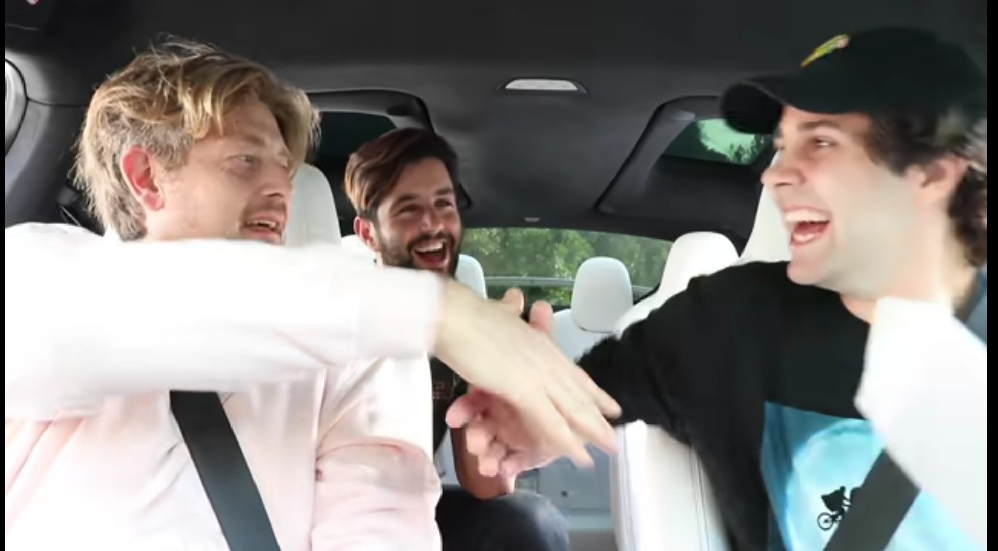 David Dobrik and Jason Nash shacking hands after receiving the news of the wedding | Source: YouTube/David Dobrik