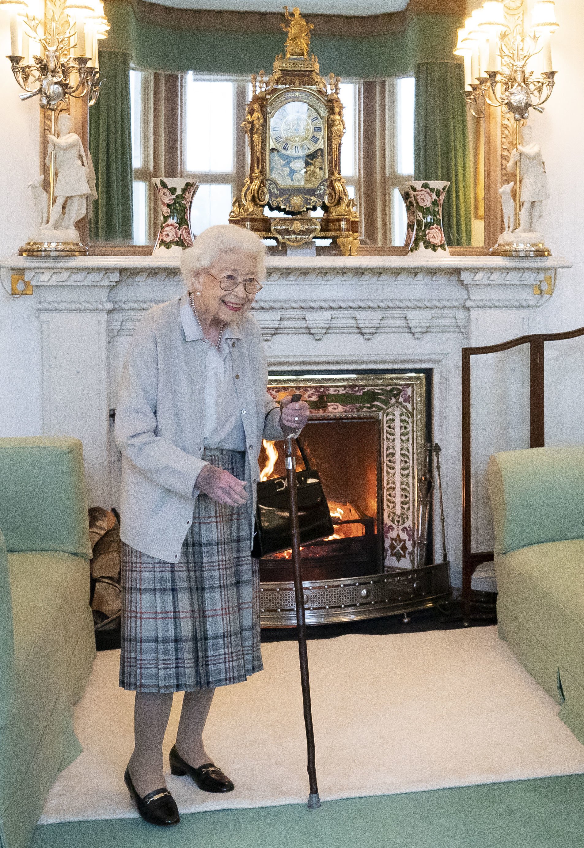 Queen Elizabeth II pictured standing with a cane at Balmoral Castle on September 6, 2022 in Ballater, Scotland | Source: Getty Images