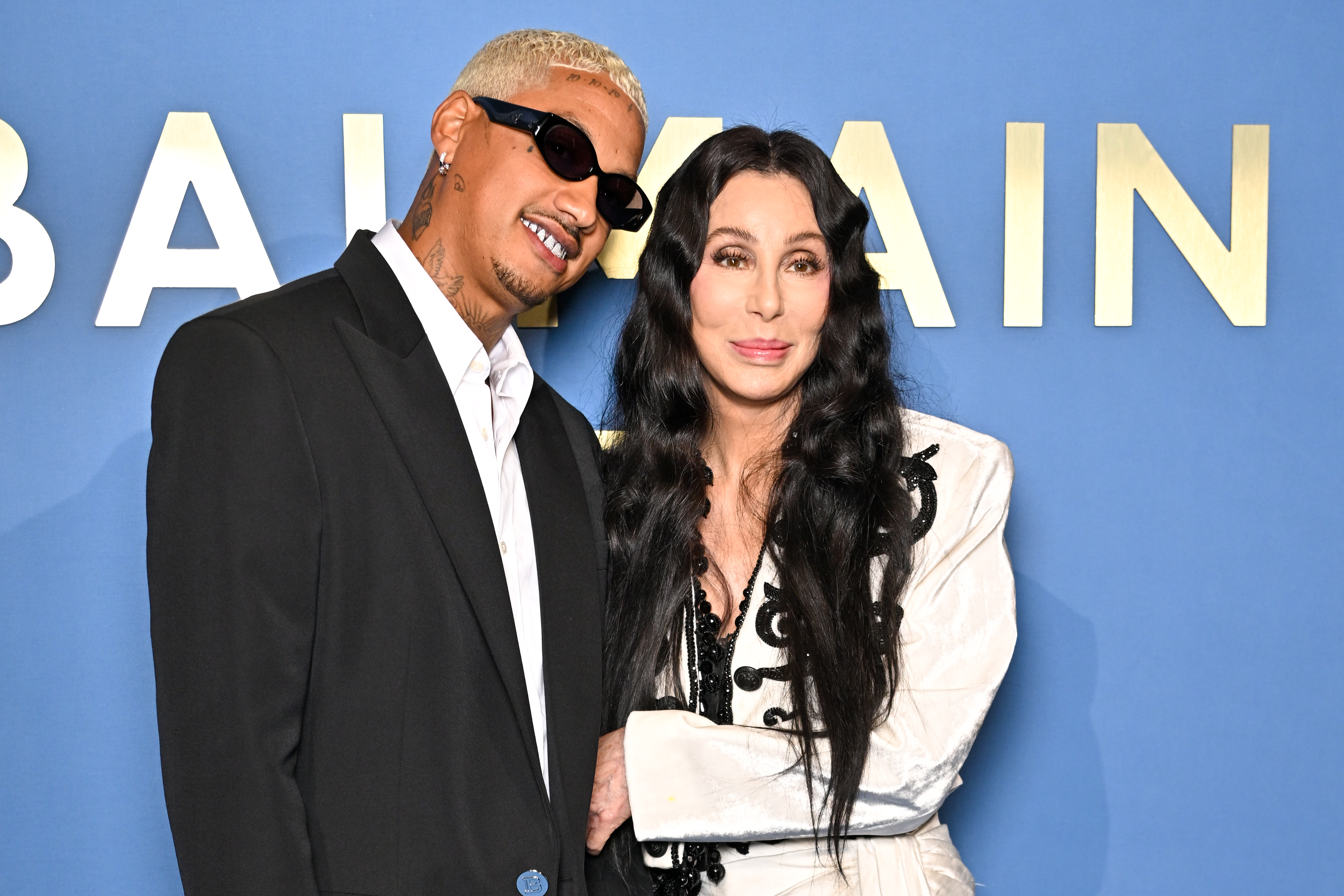 Alexander Edwards and Cher at the Balmain Womenswear Spring/Summer 2024 show in Paris, France on September 27, 2023 | Source: Getty Images