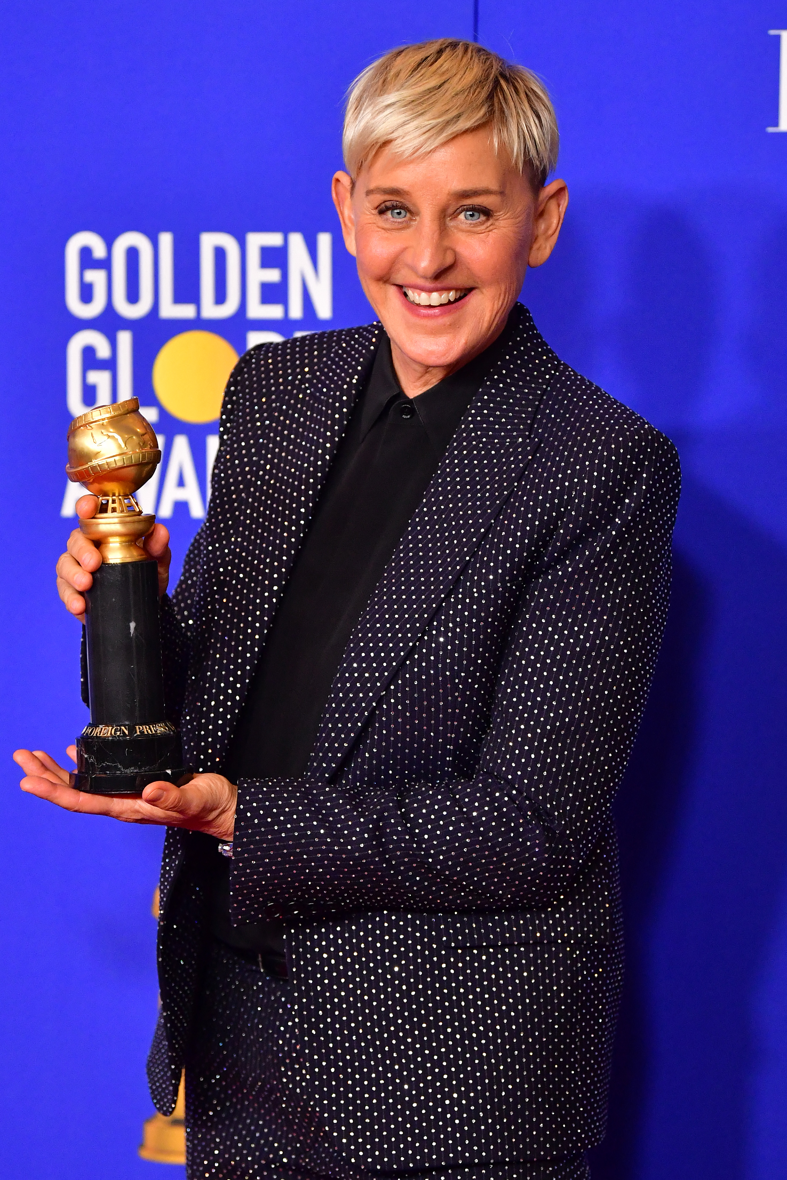 Ellen DeGeneres poses in the press room with the Carol Burnett award during the 77th annual Golden Globe Awards in Beverly Hills, California,  on January 5, 2020. | Source: Getty Images