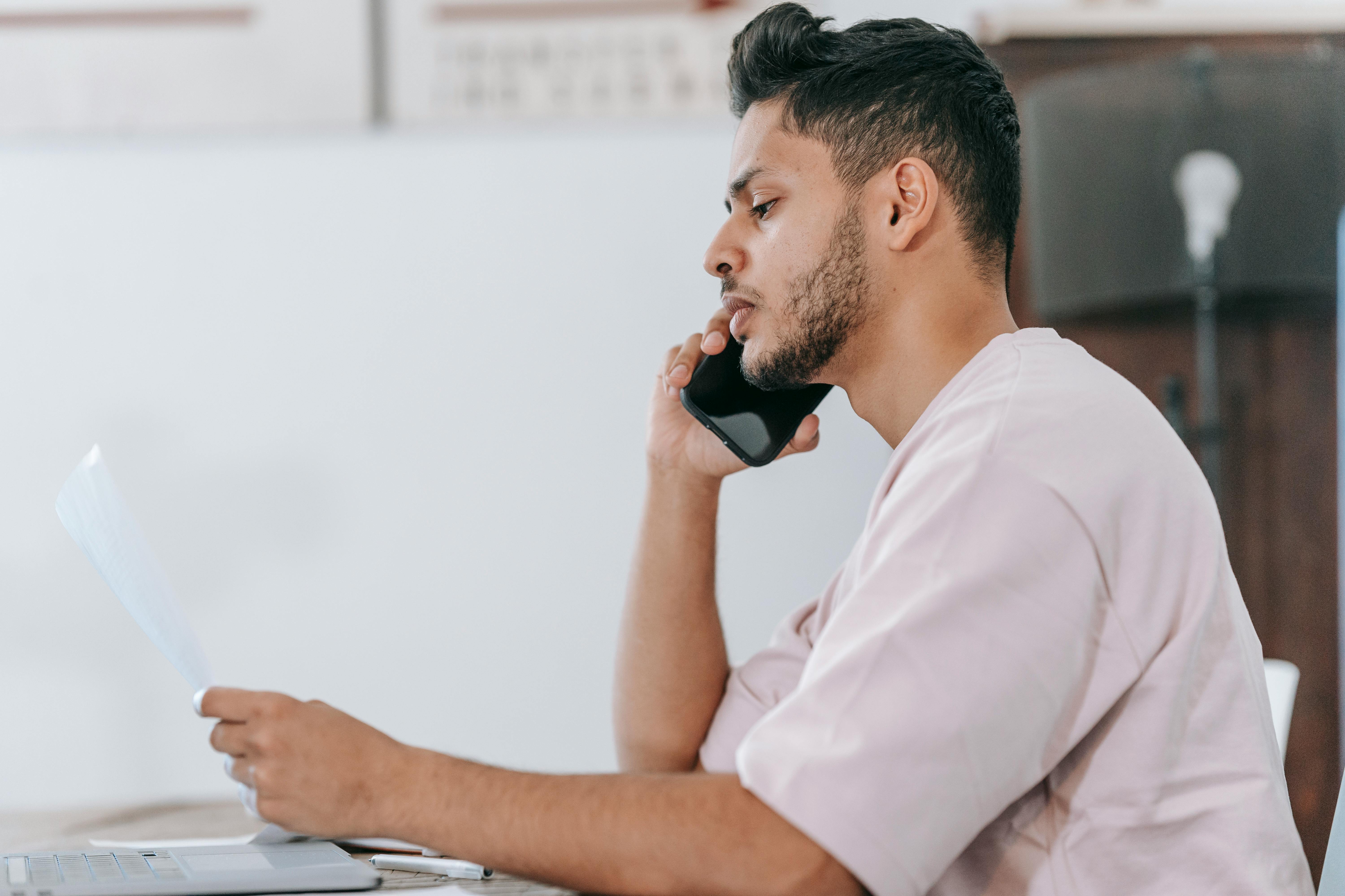 A thoughtful young man on call | Source: Pexels