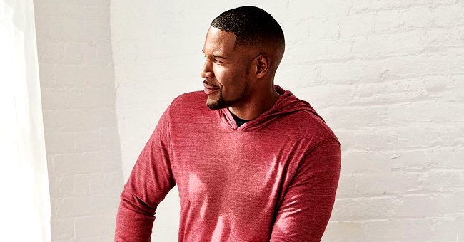 Michael Strahan Models His Own Clothing Line As He Poses In A Red 