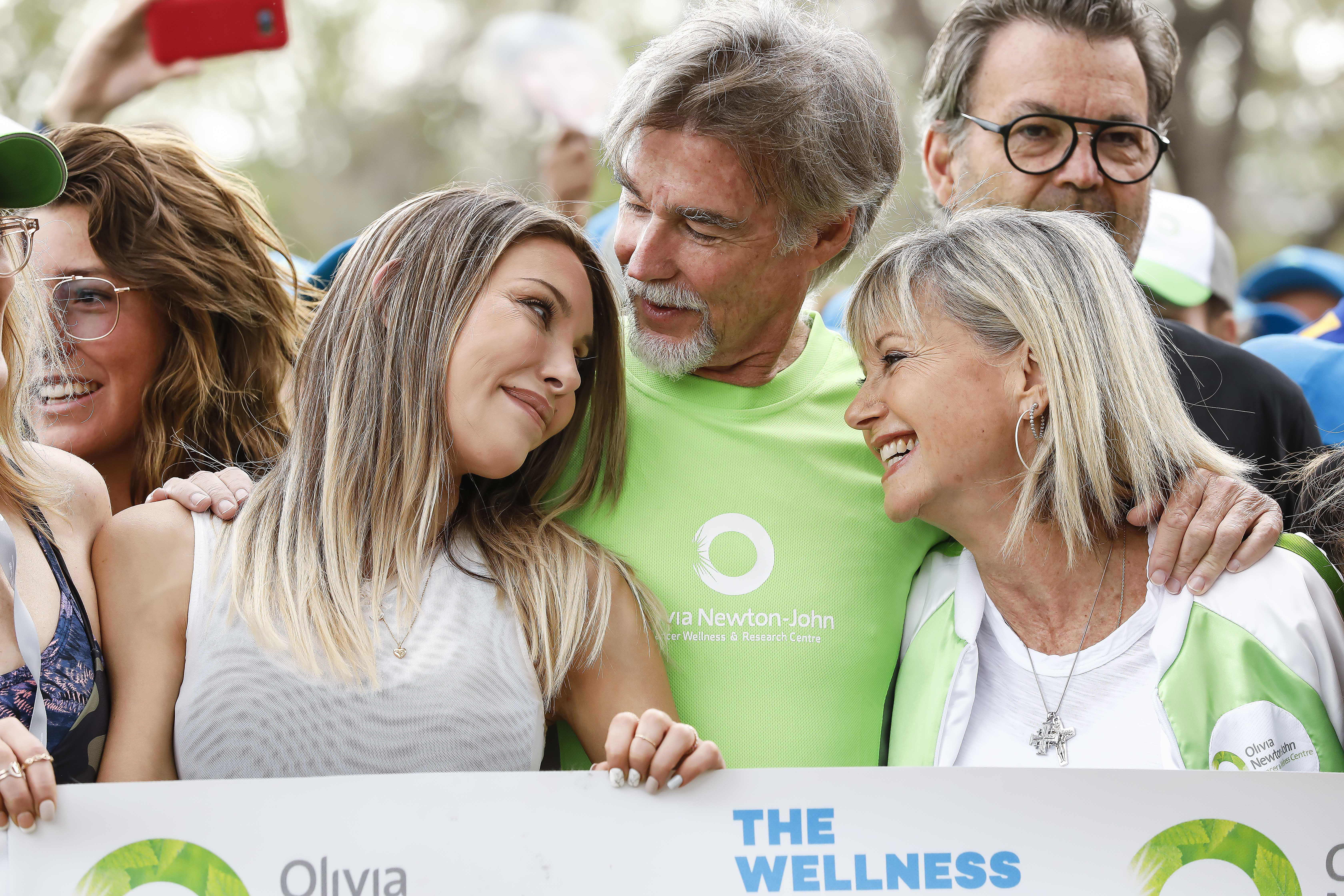 Chloe Lattanzi, John Easterling and Olivia Newton-John at the Wellness Walk and Research Run in Melbourne, Australia in 2019 | Source: Getty Images