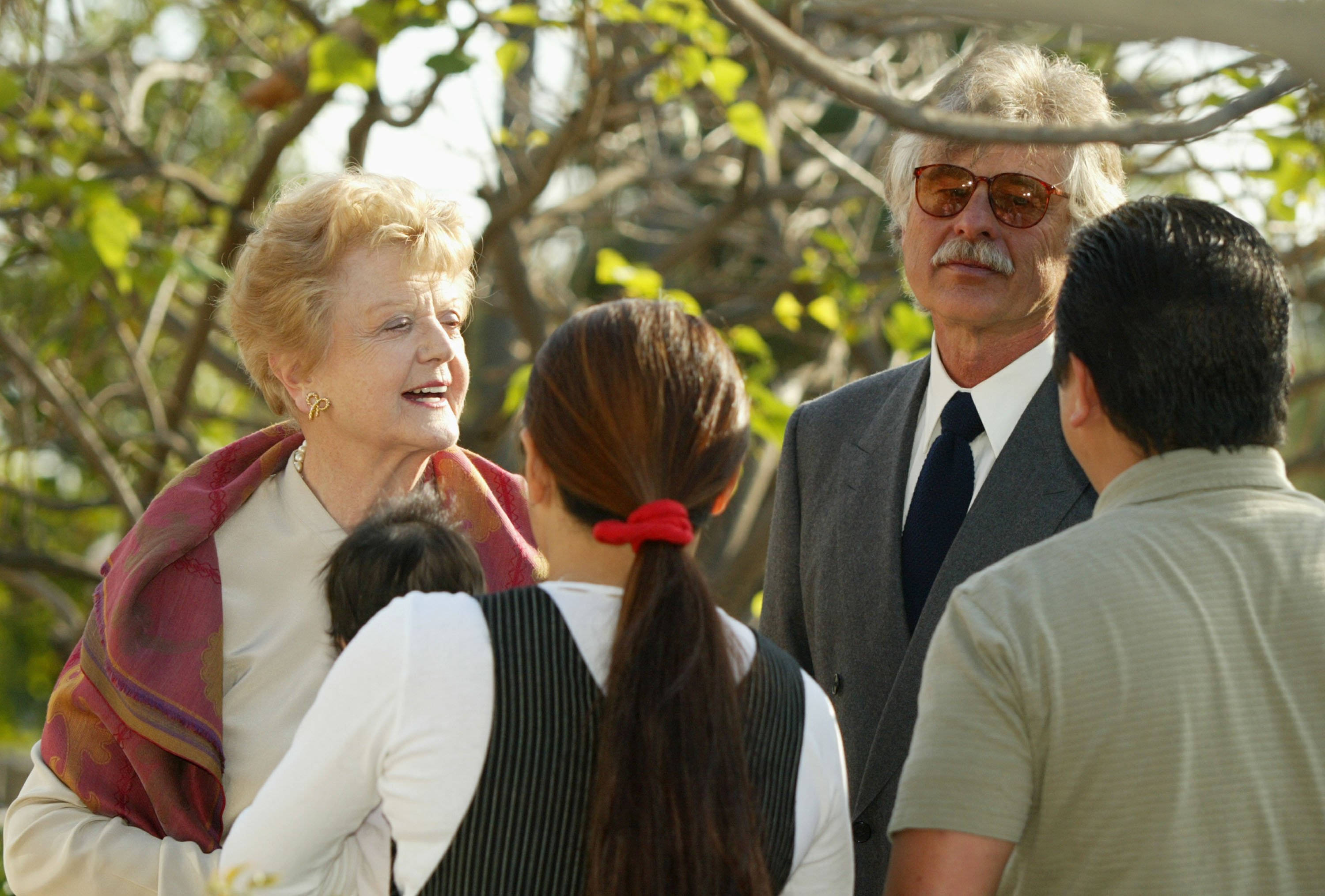 Angela Lansbury and her step son David Shaw speaking to guests in Brentwood, California 2003. | Source: Getty Images