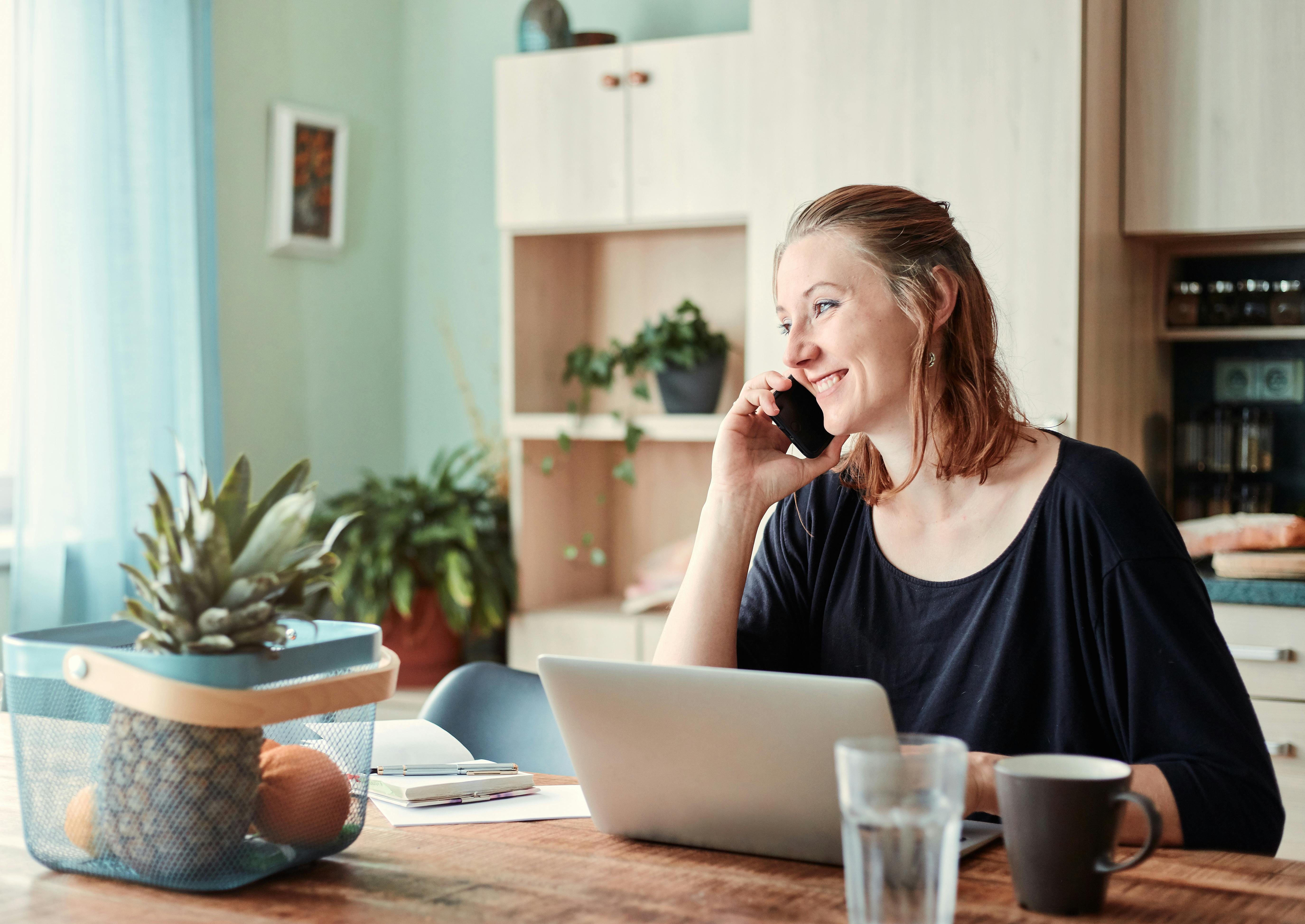 A happy woman talking on the phone | Source: Pexels