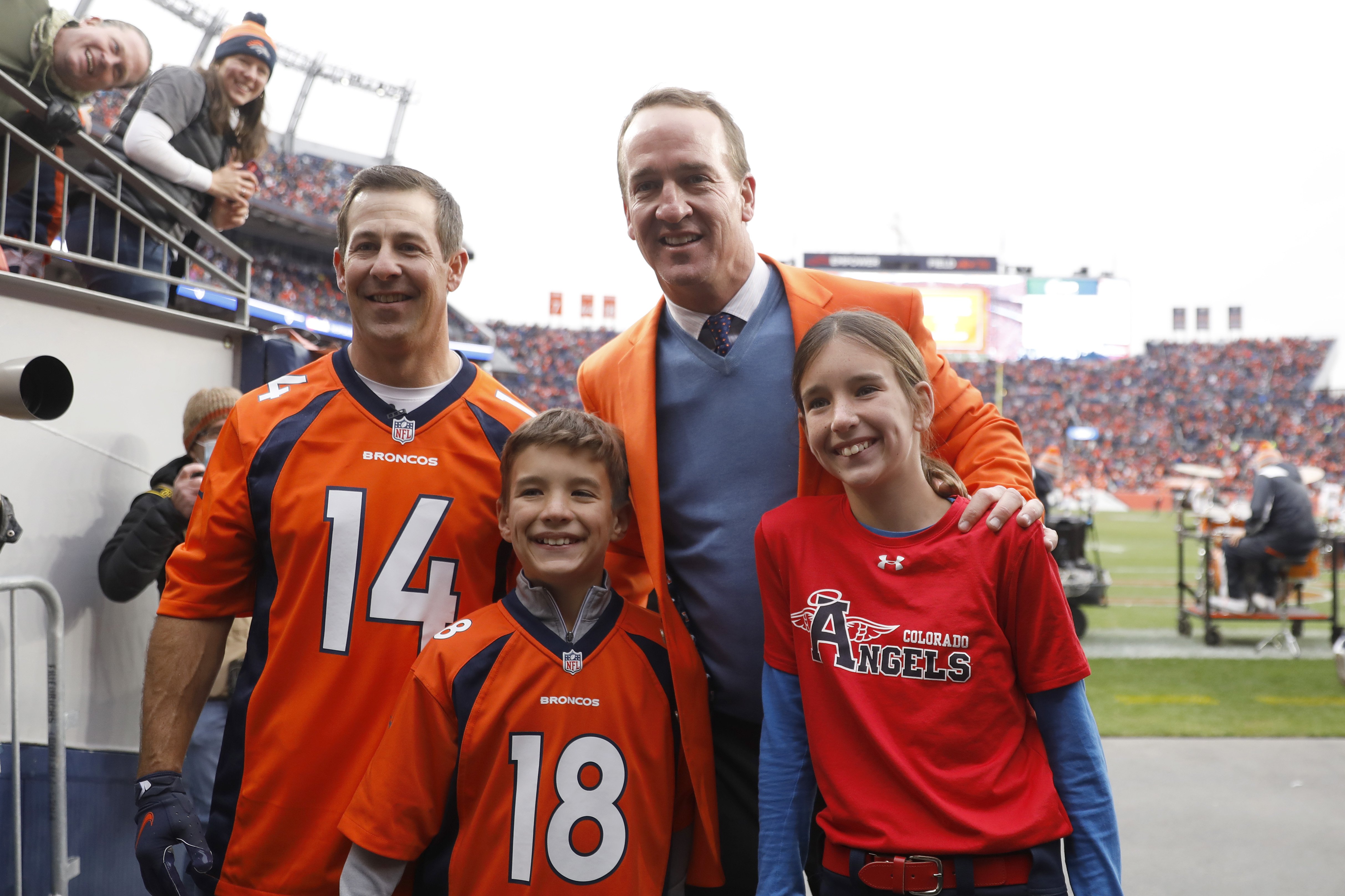 Brandon Stokely, Peyton Manning, Marshall Manning, and Mosley Manning at the Ring of Honor induction ceremony in Denver on October 31, 2021 | Source: Getty Images