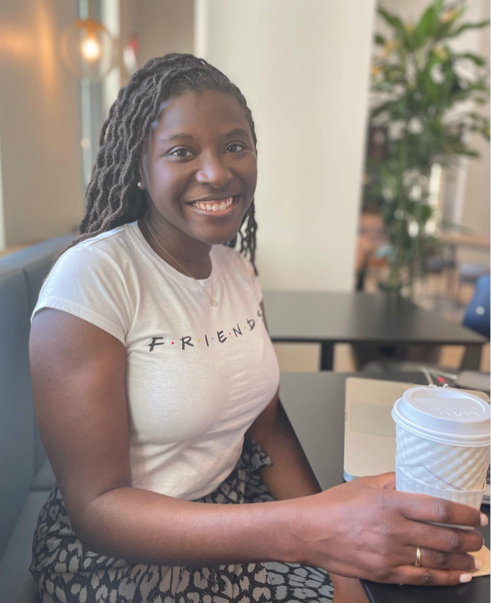 Seated with a coffee in hand, Nancy Metayer Bowen smiles directly at the camera, her laid-back style and calm presence capturing a simple, everyday pause. | Source: Instagram/nancymetayerbowen