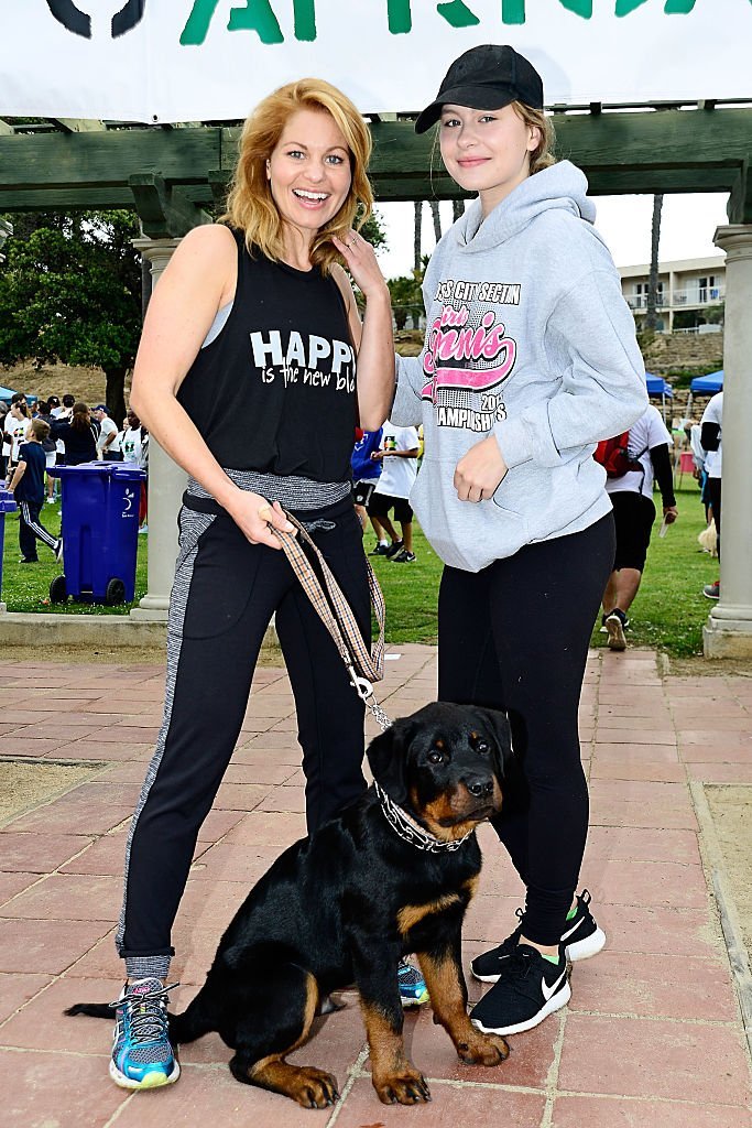 Candace Cameron-Bure, daughter Natasha and 4 month old puppy Boris attend the 7th Annual Walk To Africa  | Getty Images