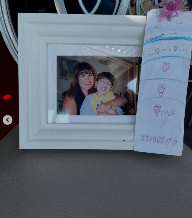 A framed picture of Kristy Adler's mother with her brother in a post dated March 16, 2025 | Source: Instagram/kristyadlerart