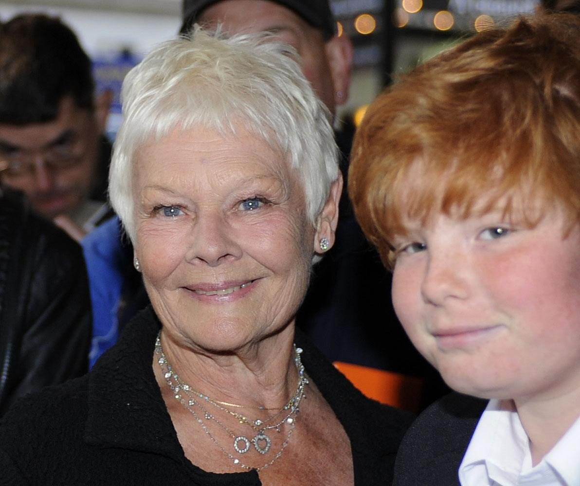 Dame Judi Dench and grandson Sam arrive at The Novello Theatre, The Aldwych for the press night of "Betty Blue Eyes" on April 13, 2011 in London, England ┃Source: Getty Images