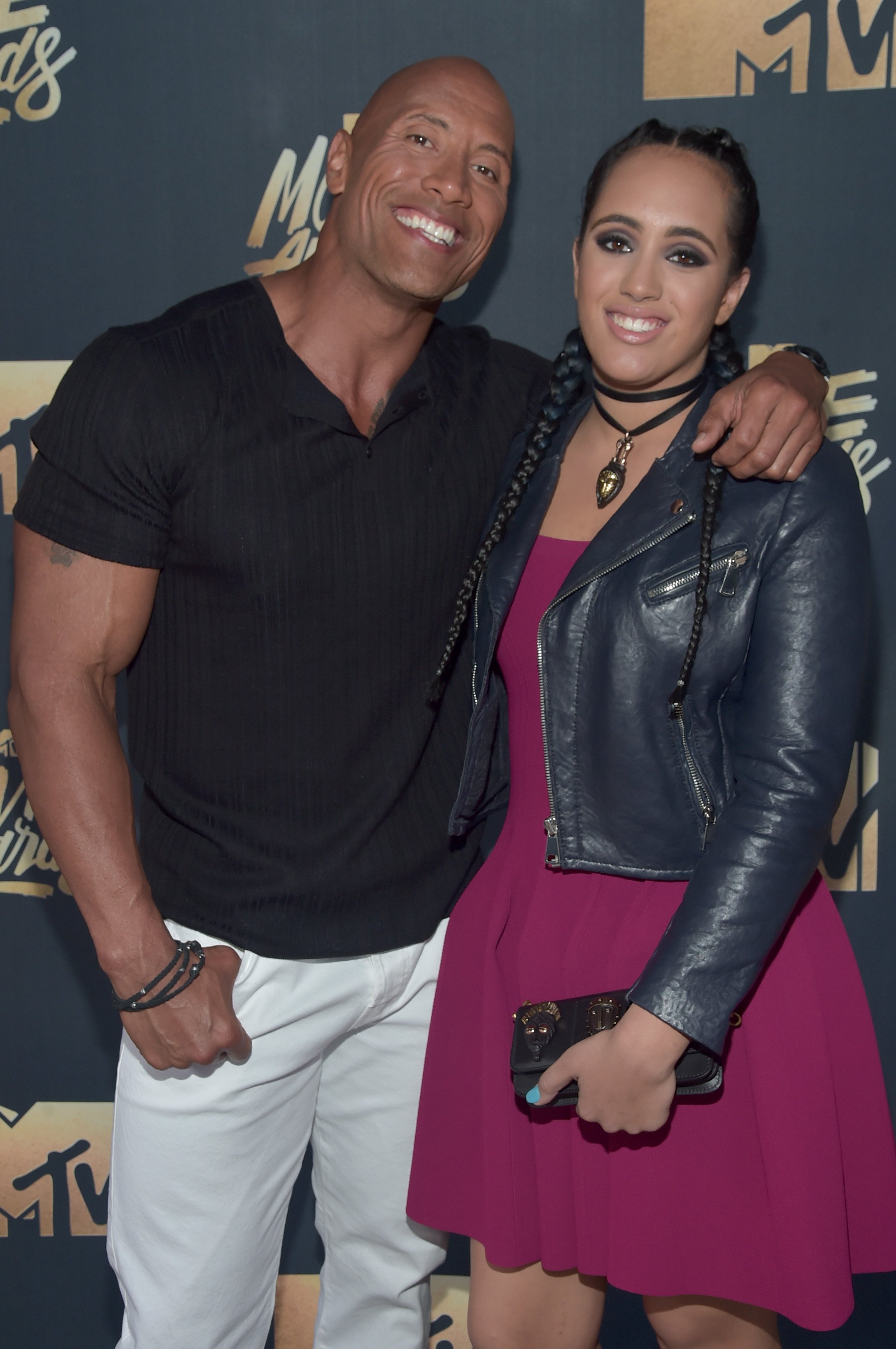 Dwayne Johnson and his daughter, Simone Alexandra Johnson attend the 2016 MTV Movie Awards at Warner Bros. Studios on April 9, 2016 in Burbank, California | Photo: Getty Images