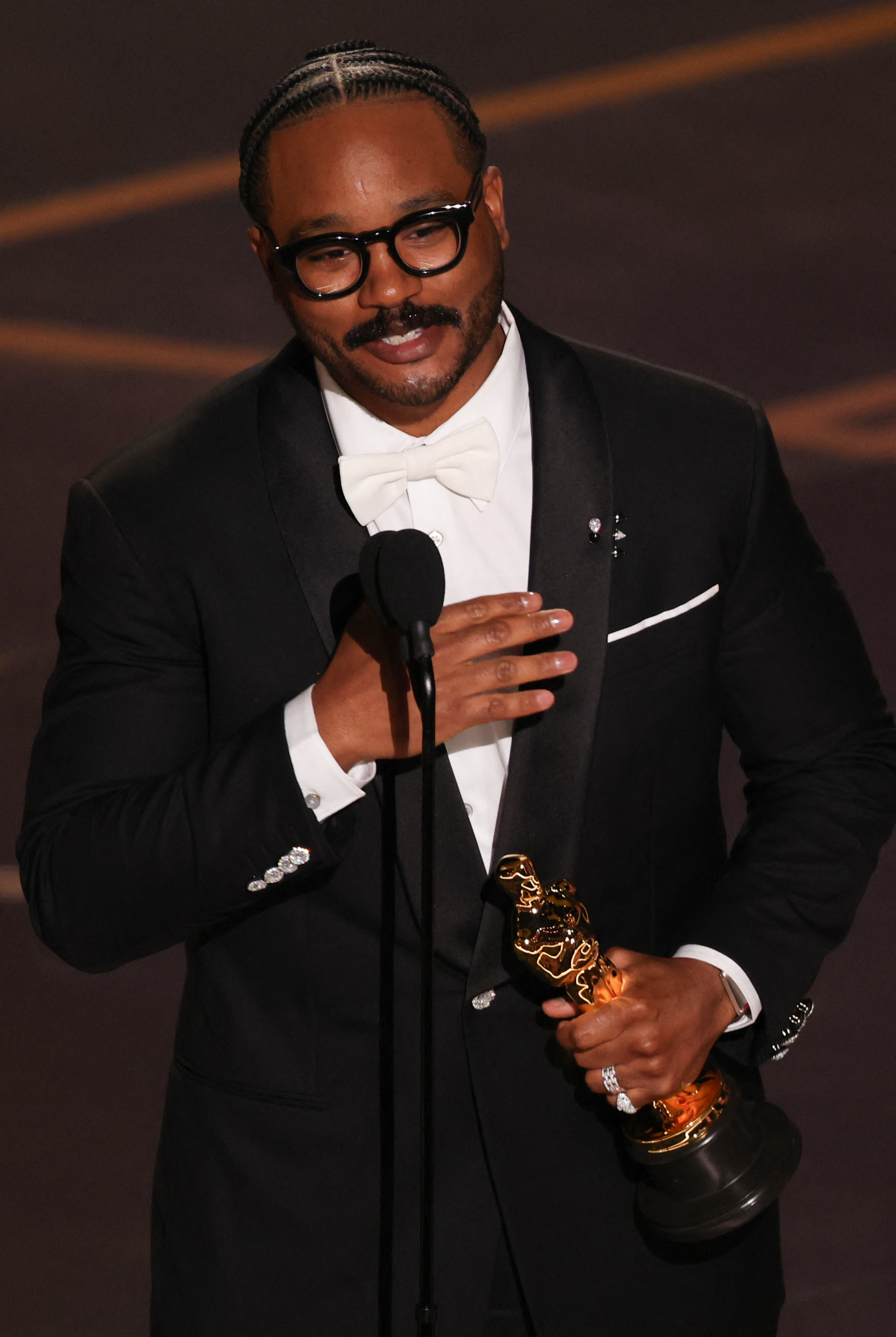 Ryan Coogler accepts the award for Best Writing (Original Screenplay) for "Sinners" | Source: Getty Images