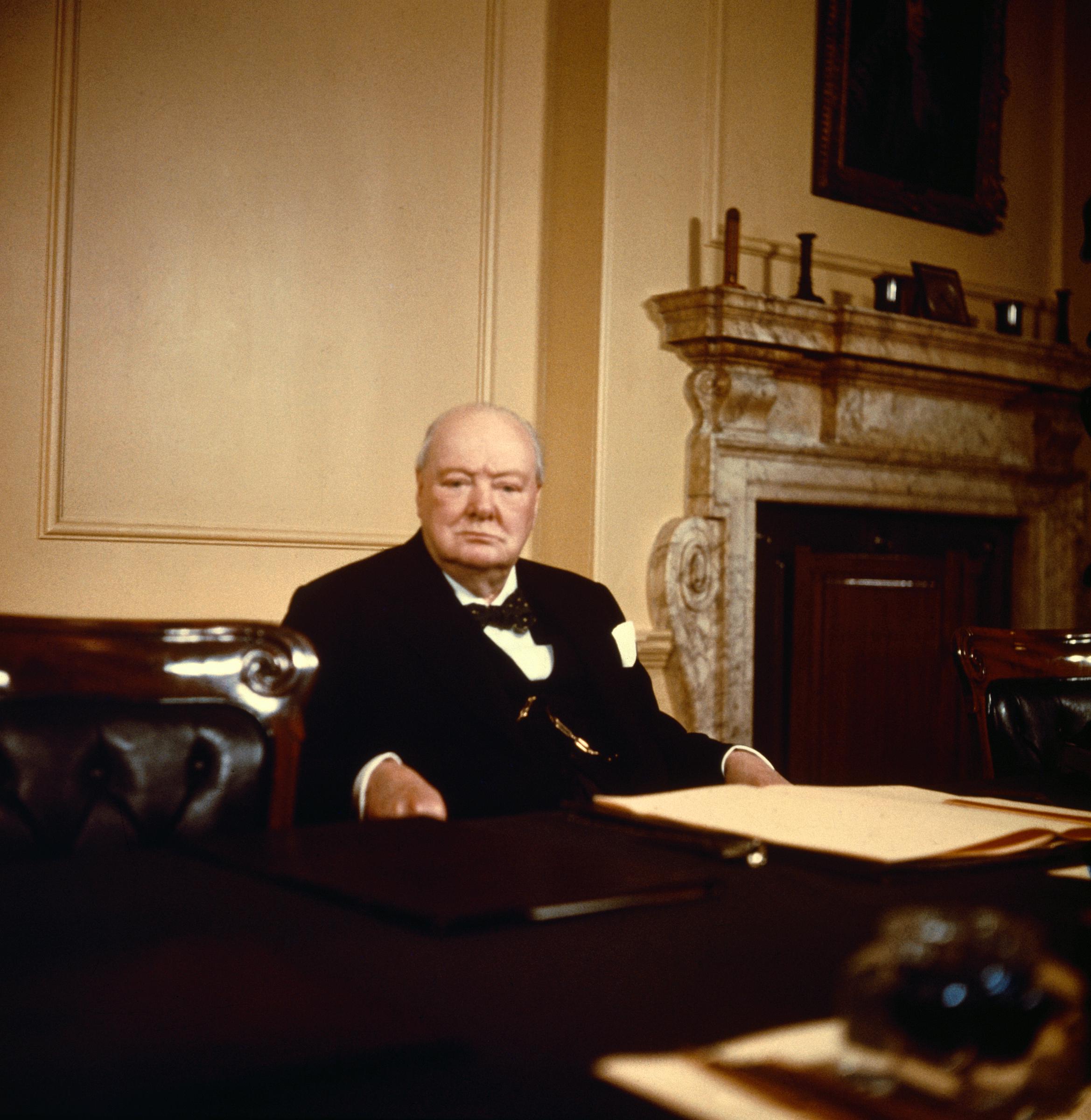 Sir Winston Churchill photographed at his desk on his 80th birthday in 1954. | Source: Getty Images