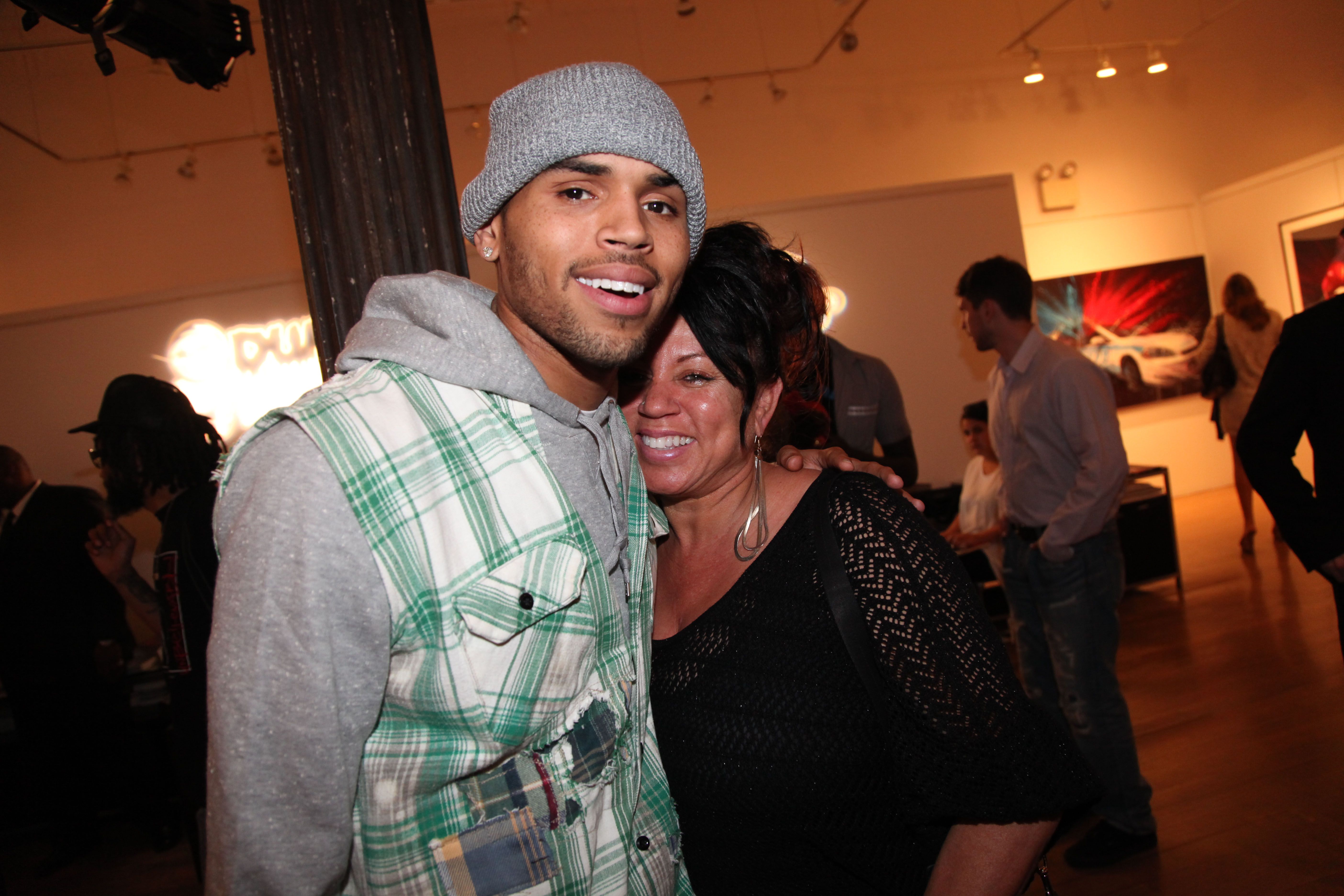 Chris Brown and Joyce Hawkins attend the Dum English Exhibition Opening at Opera Gallery on June 11, 2012 in New York City. | Photo: Getty Images