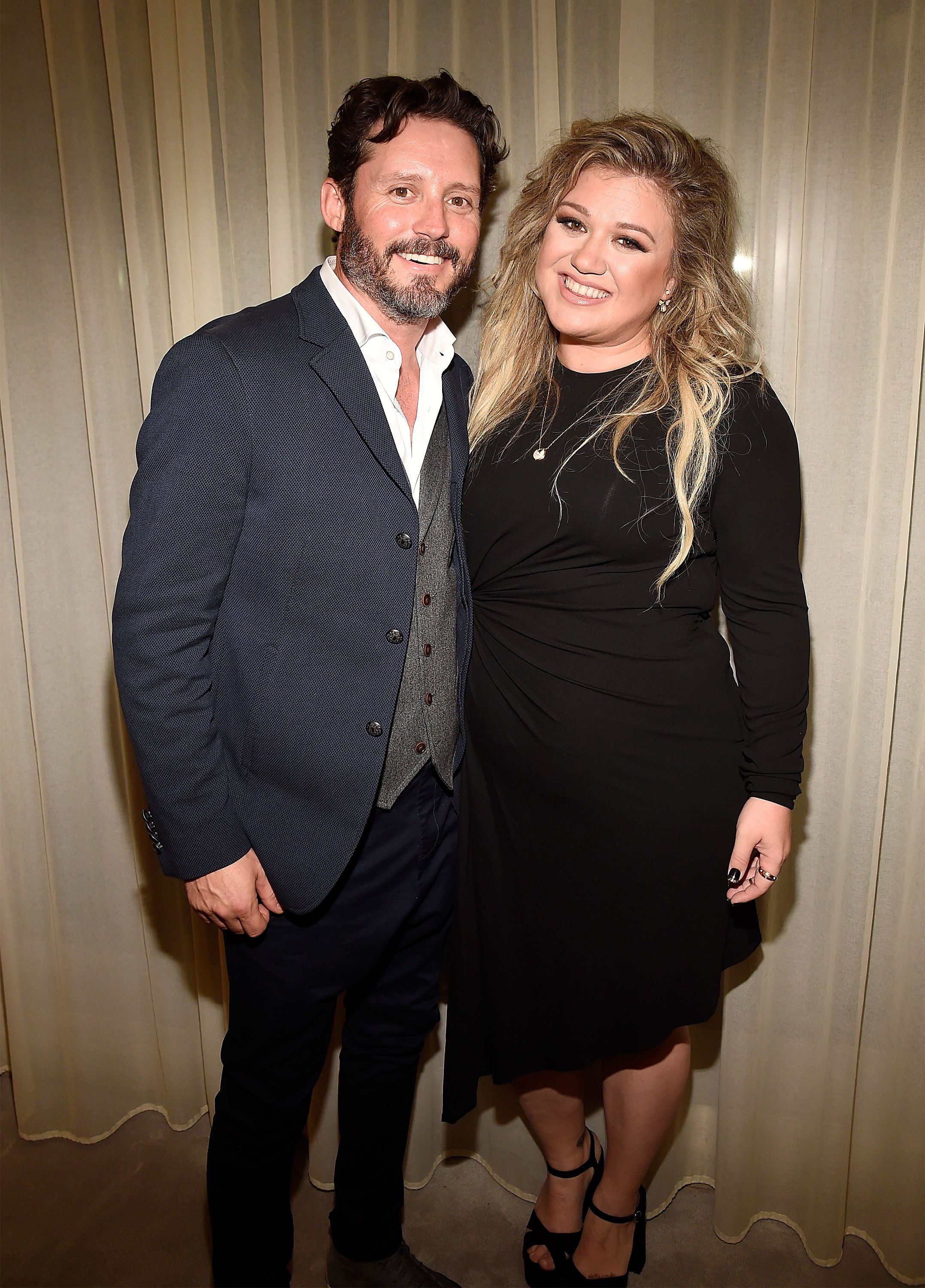 Brandon Blackstock and Kelly Clarkson backstage after she performed songs from her new album "The Meaning of Life" at The Rainbow Room on September 6, 2017 | Photo: Getty Images