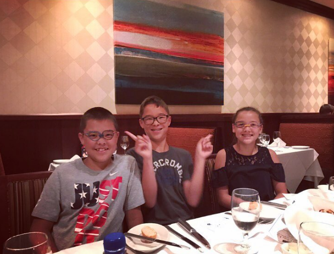 Despite the problems with their parents, the children's childhood often seemed normal. In this photo, three of the kids, including Collin, smiled together at a restaurant on July 23, 2017. | Source: Instagram/kateplusmy8