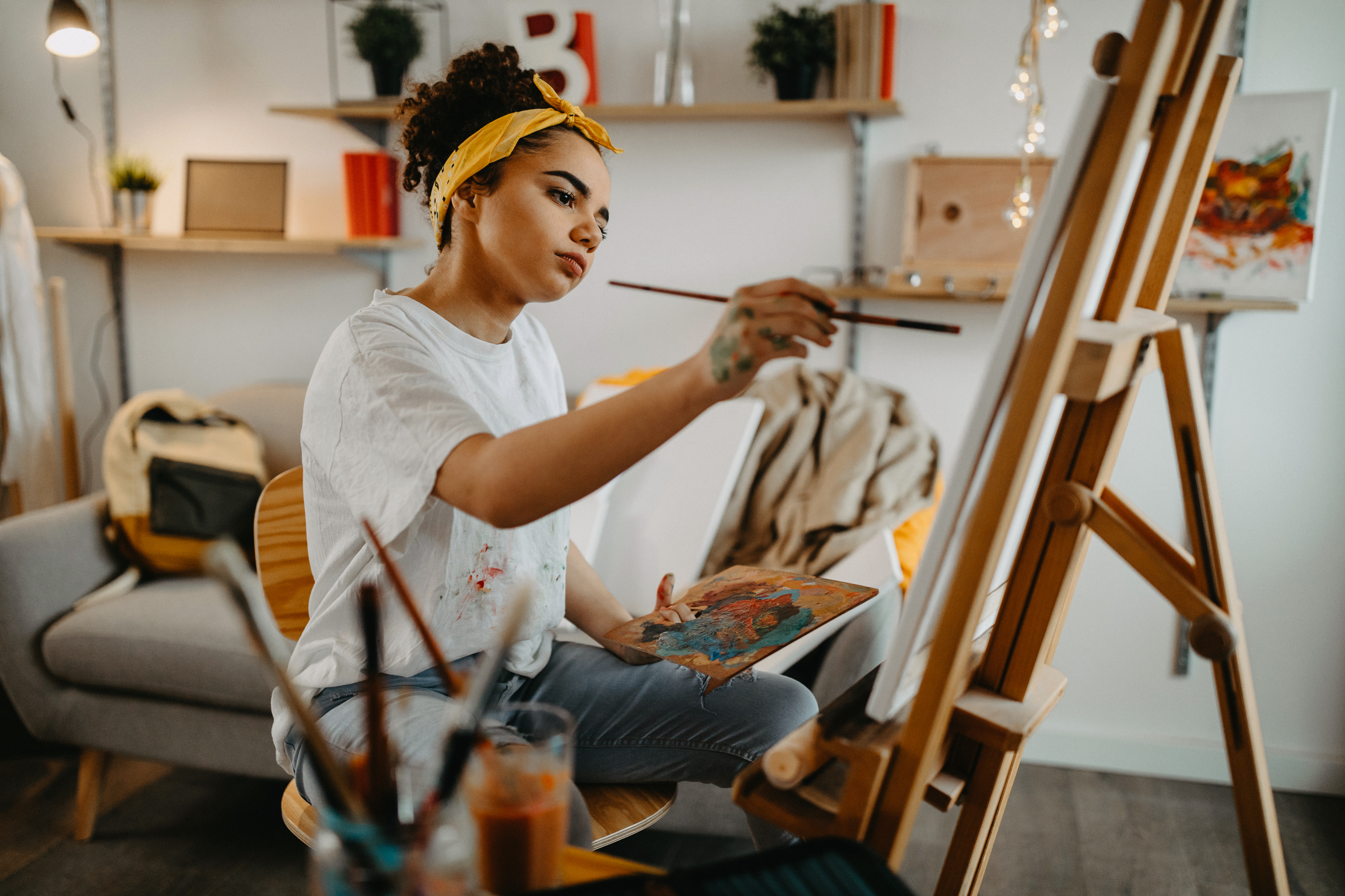 A young woman painting | Source: Getty Images