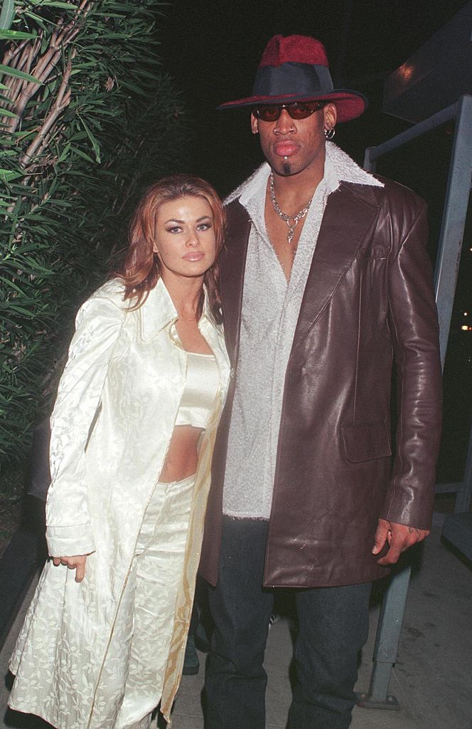 Dennis Rodman celebrates his first winning game out on the town at GOODBAR with wife Carmen Electra. | Source: Getty Images
