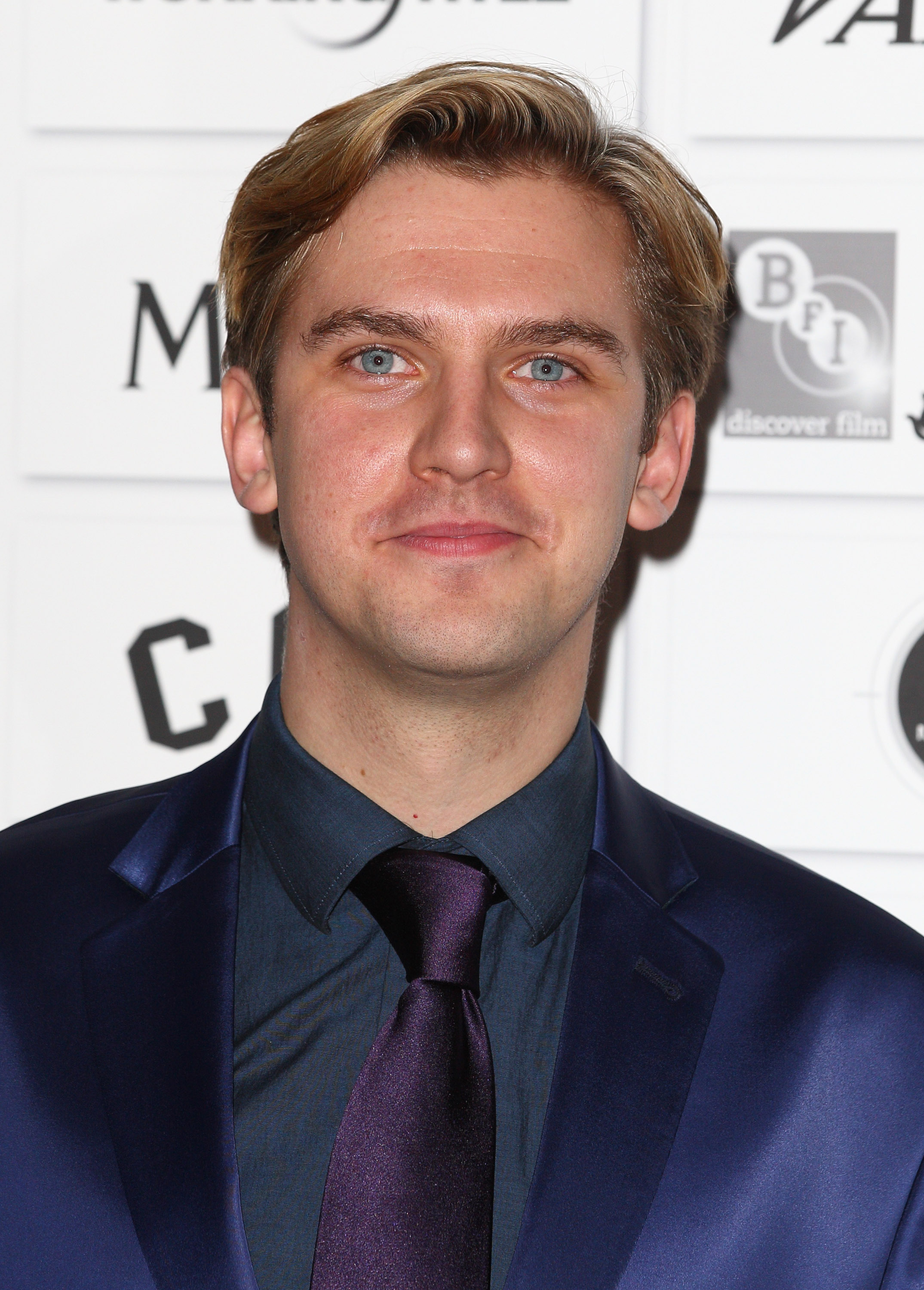 Dan Stevens attended the 2011 Moet British Independent Film Awards with a clean-cut look, sporting a navy suit, dark shirt, and matching tie. With his neatly combed blonde hair and polished style, he looked every bit the rising star freshly launched into the spotlight by "Downton Abbey."