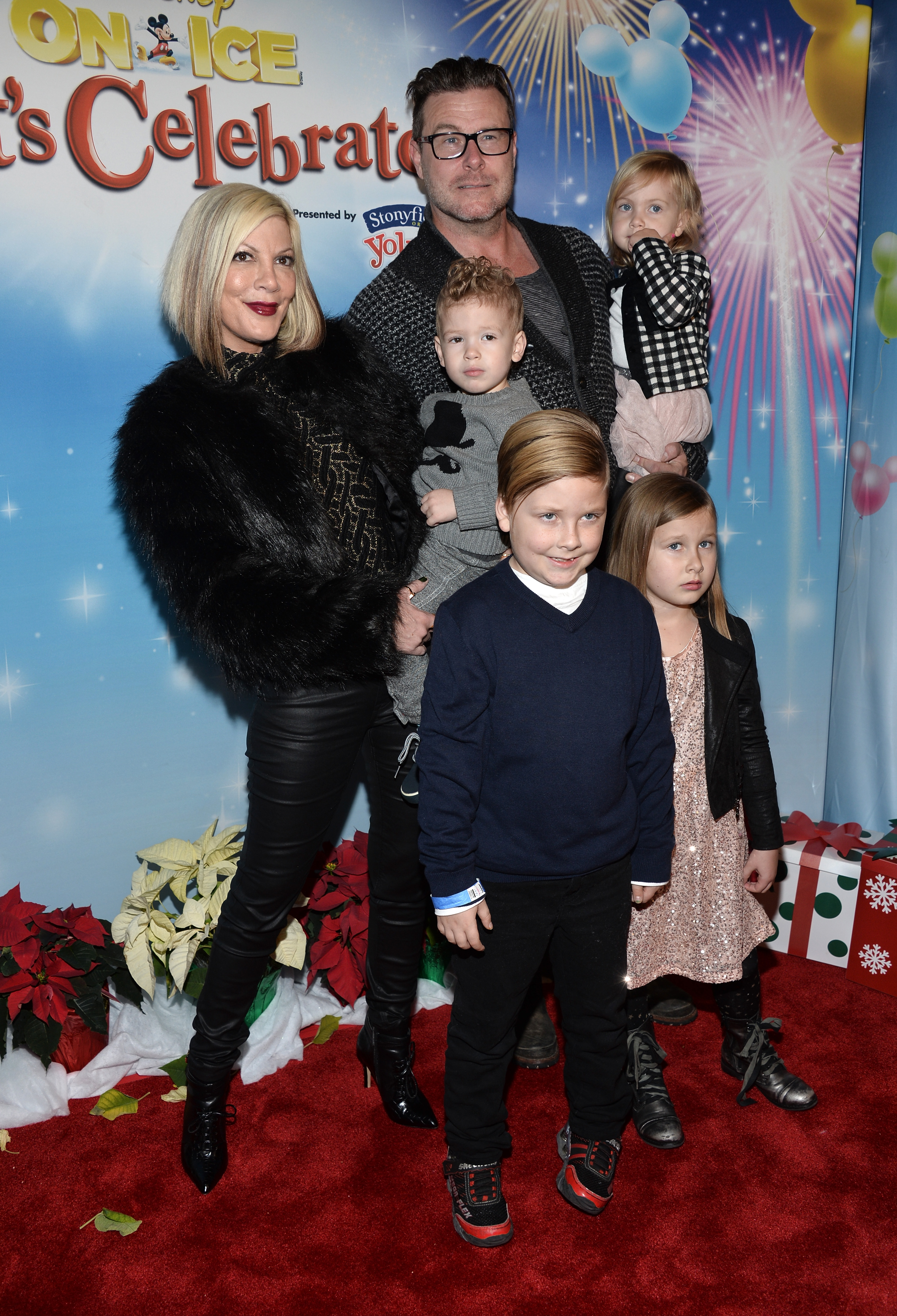 Tori Spelling with her husband, Dean McDermott, and their children at the Disney on Ice Presents Let's Celebrate! event on December 11, 2014, in Los Angeles, California. | Source: Getty Images