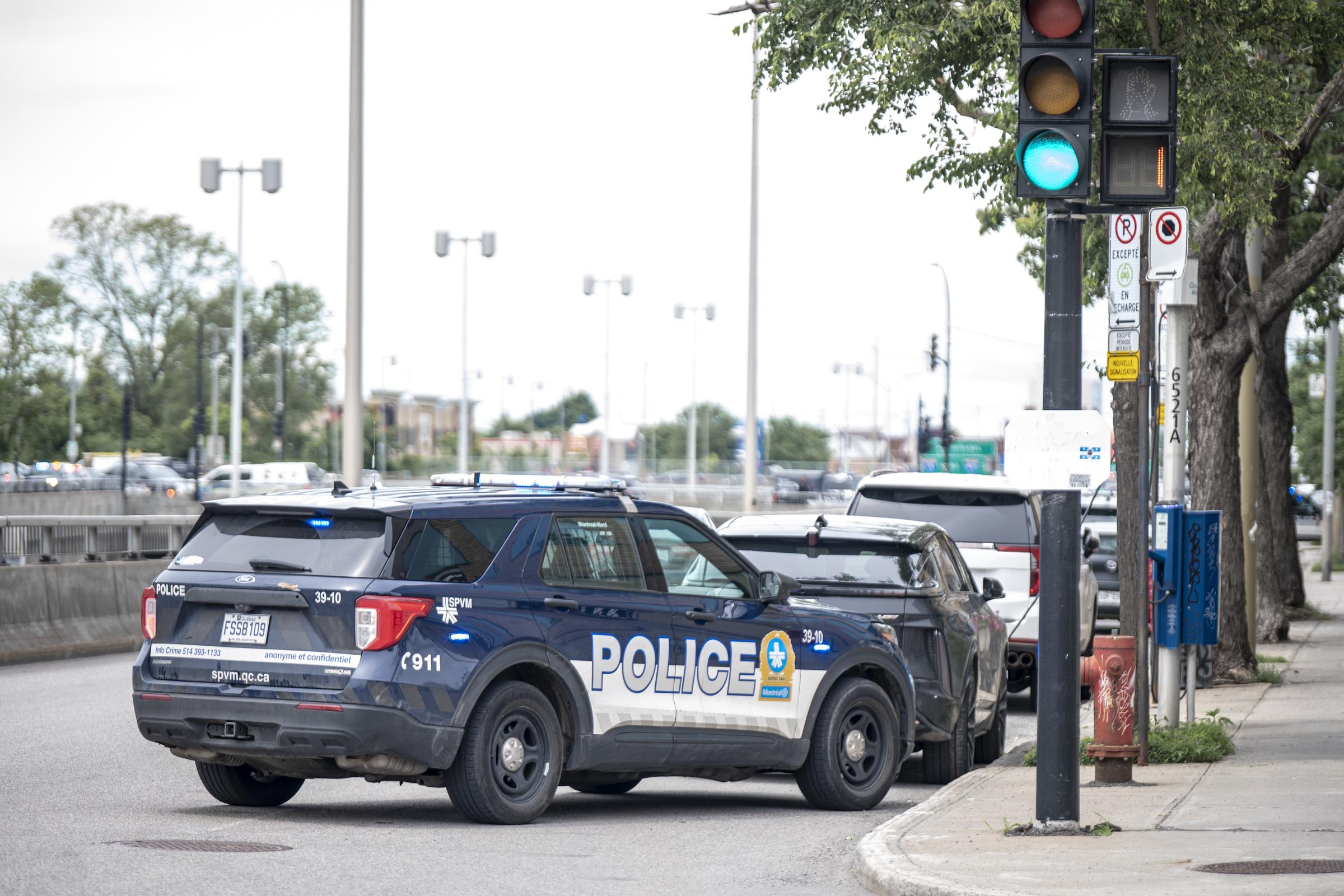 Police vehicles remained at the scene after the shooting that killed Const. Mohamed Lamine Benredouane, a Montreal police officer who had served with the SPVM since 2021. | Source: Getty Images