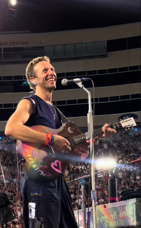 Chris Martin gives a wry smile before making the comment that has the internet divided, from a video post dated July 20, 2025 | Source: TikTok/jarev91