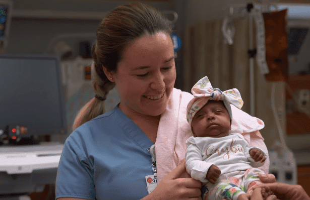 Saybie being held by a nurse | Photo: Sharp HealthCare