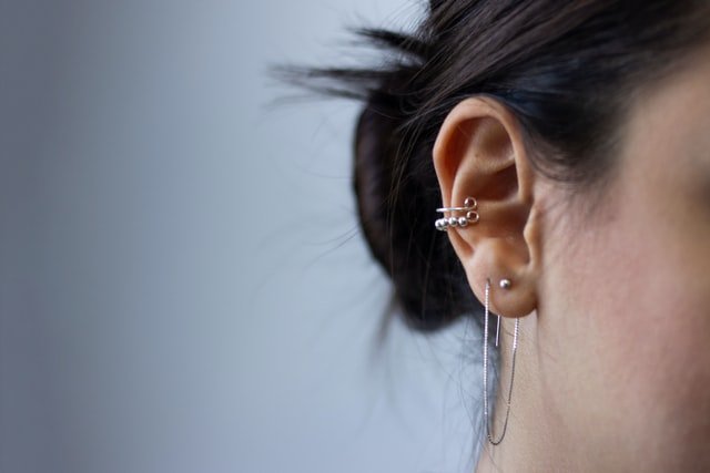 Woman wearing silver earrings | Source: Unsplash