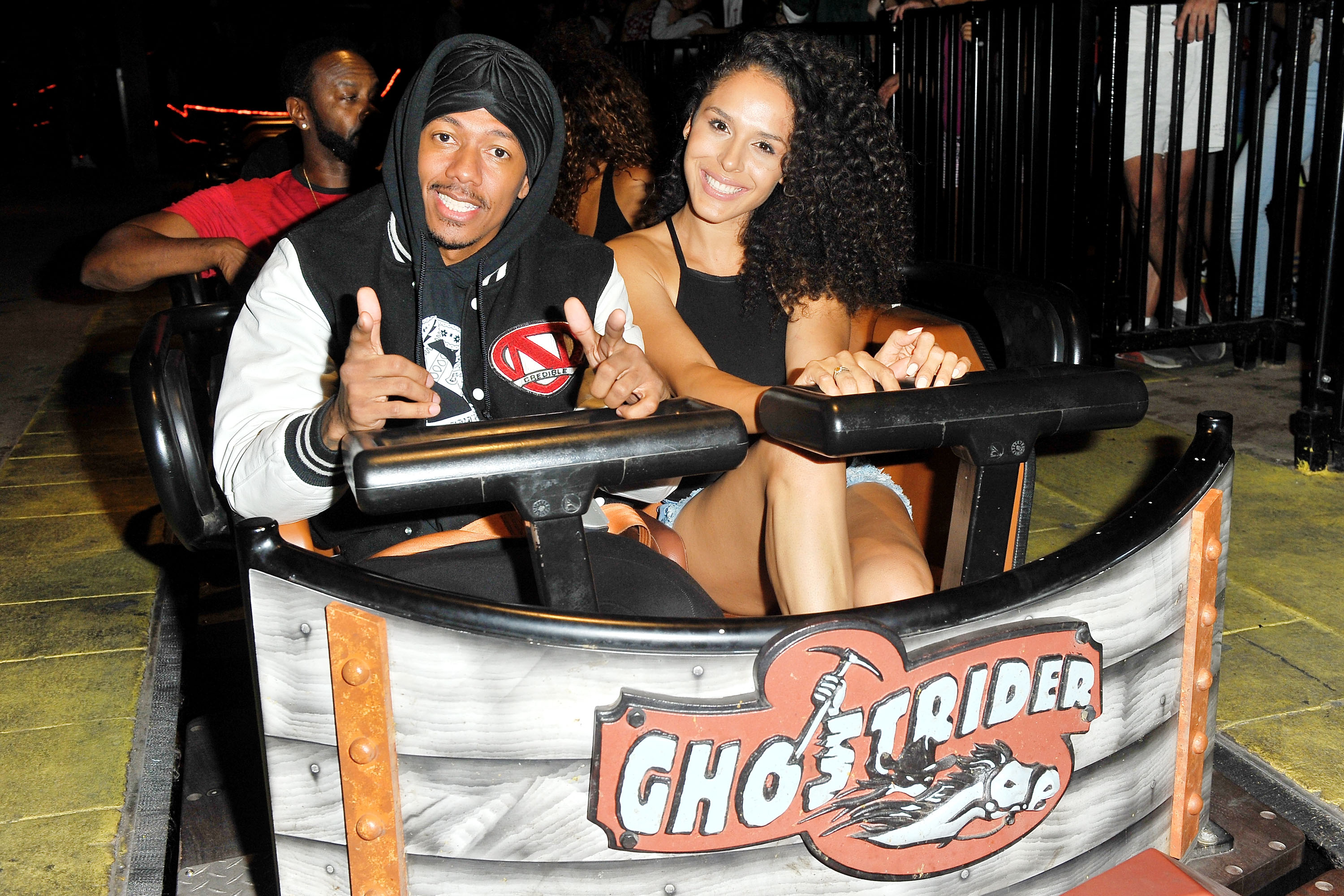 Nick Cannon and Brittany Bell on the 'Ghostrider' Roller Coaster at Knott's Berry Farm, Buena Park, California, September 1, 2017 | Source: Getty Images