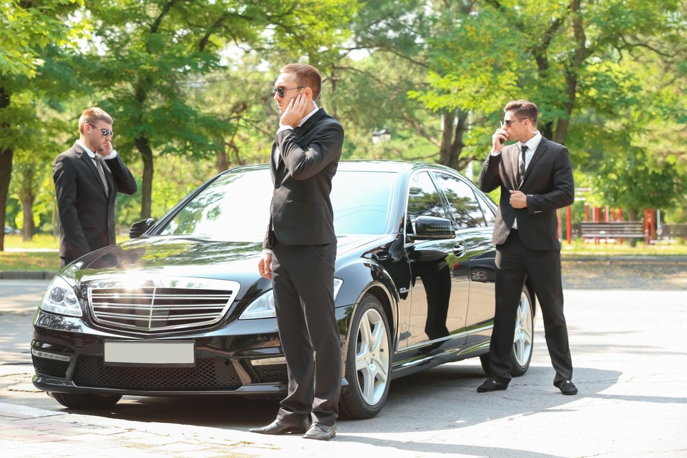 Bodyguards waiting patiently for their bosses to be done | Photo: Shutterstock