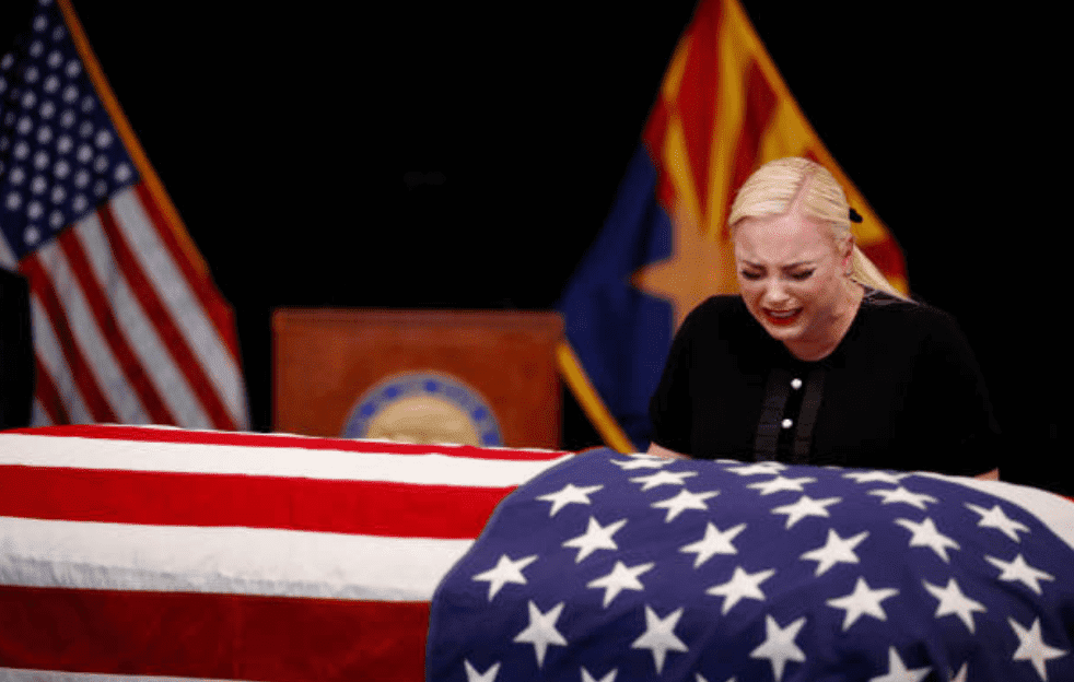 Meghan McCain, weeps over the casket of her father, Sen. John McCain, during a memorial service, on August 29, 2018, in Phoenix, Arizona | Source: Jae C. Hong - Pool/Getty Images
