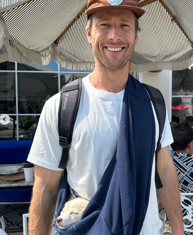 The actor carries with his dog, dated July 5, 2023 | Source: Instagram/glenpowell