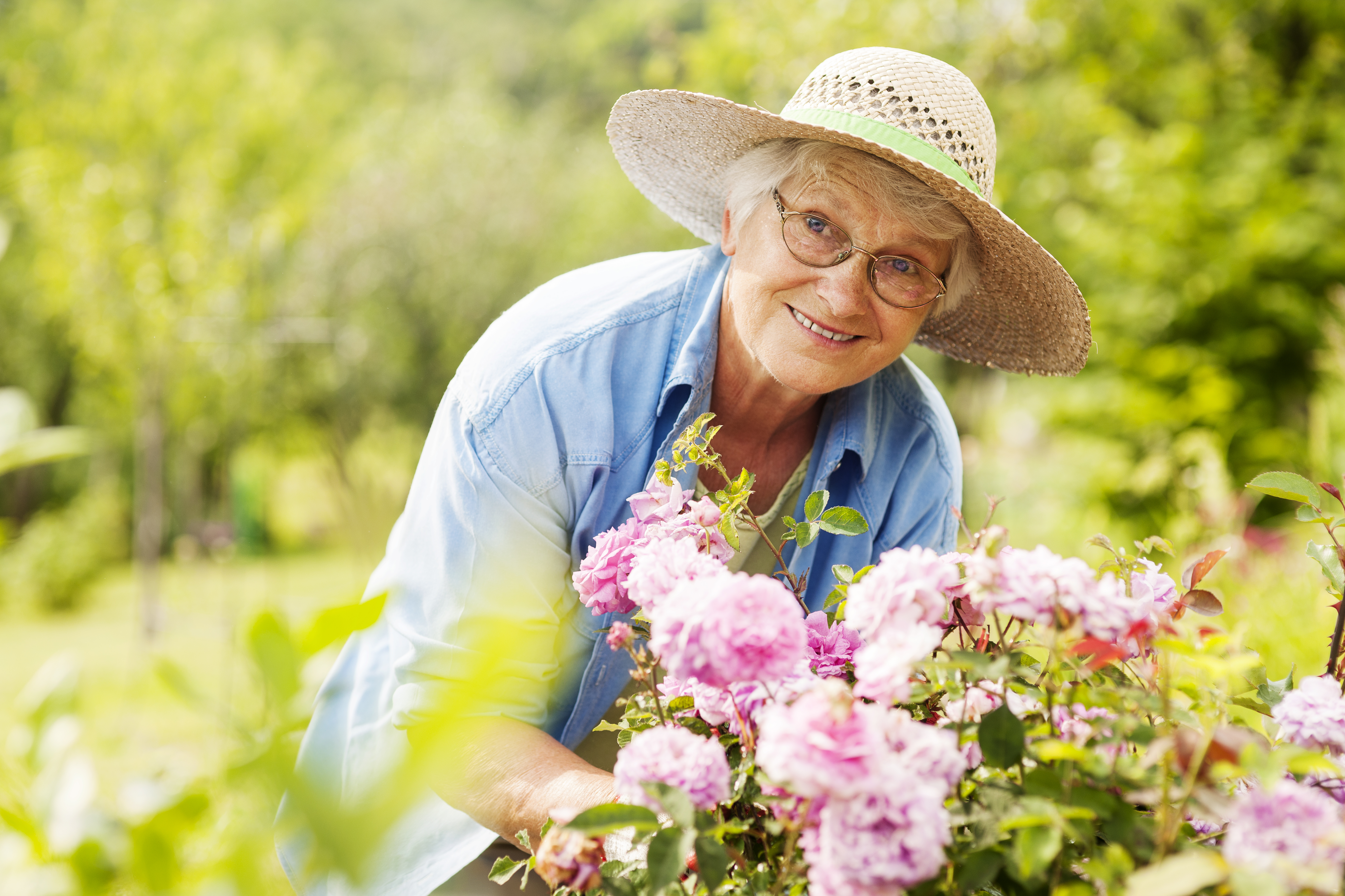Senior woman with flowers in garden | Source: Getty Images