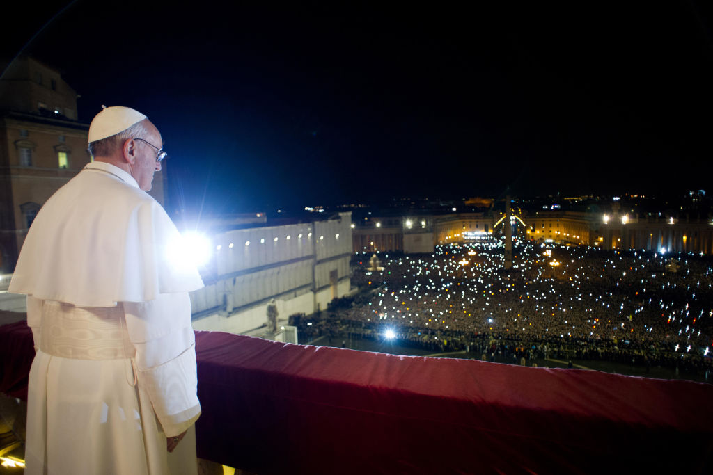 Newly named Pope Jose Mario Bergoglio appears, on the balcony of St. Peter's Basilica, as Pope Francesco, elected in the second ballot of their secret conclave on March 13, 2013 in Vatican City, Vatican