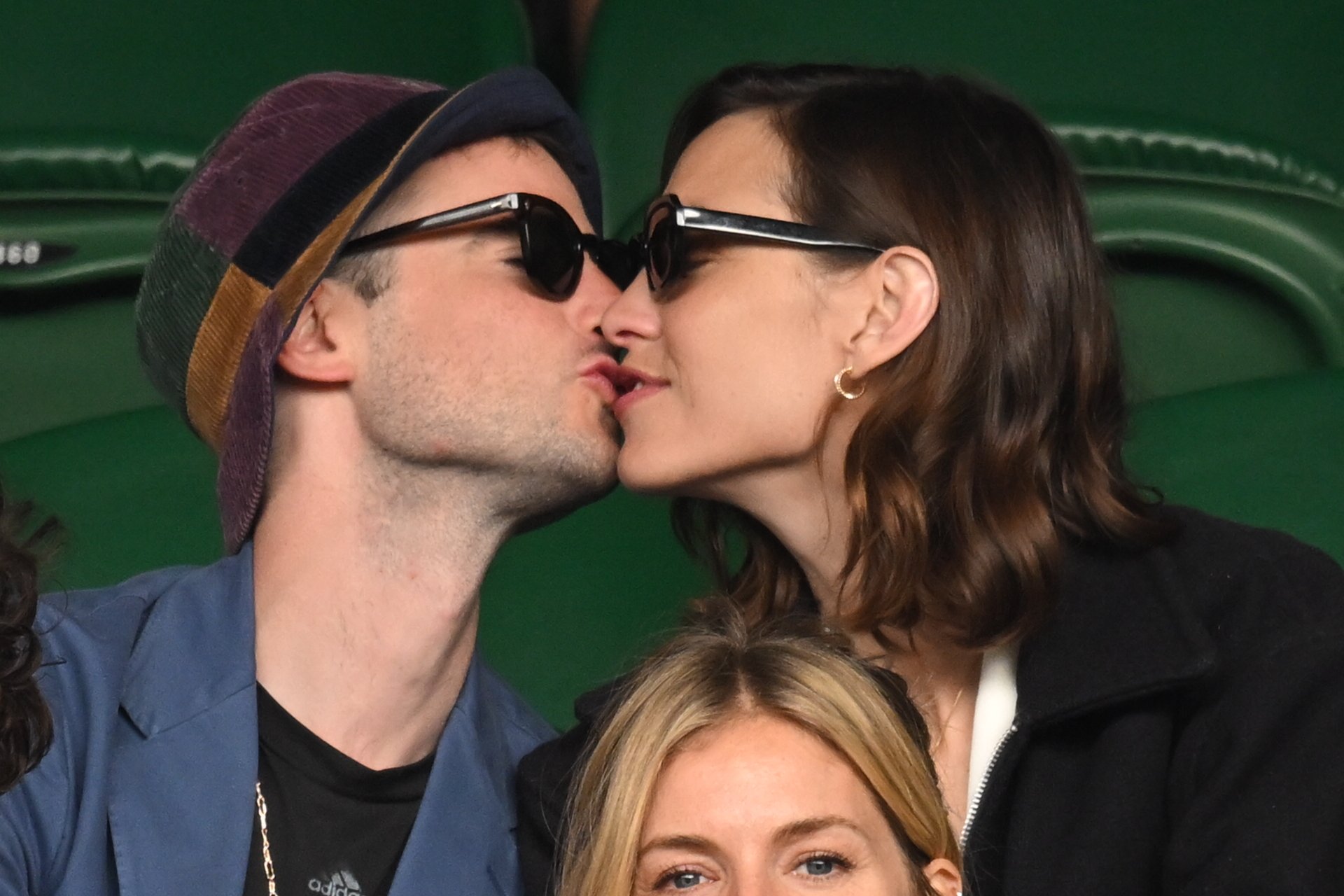 Tom Sturridge and Alexa Chung share a kiss while attending Wimbledon on July 3, 2022, in London, England. | Source: Getty Images