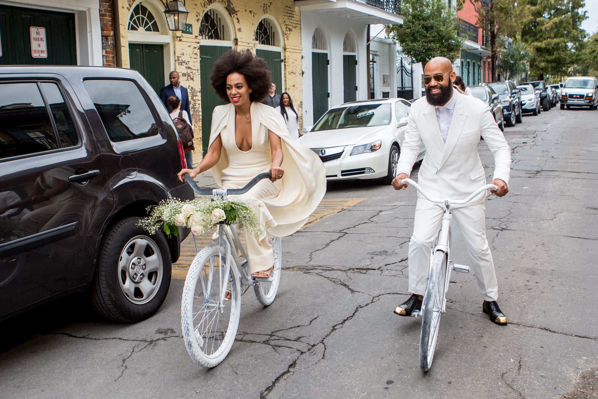 Solange Knowles and fiance Alan Ferguson ride bicycles to their wedding ceremony at the Marigny Opera House on November 16, 2014, in New Orleans, Louisiana | Source: Getty Images
