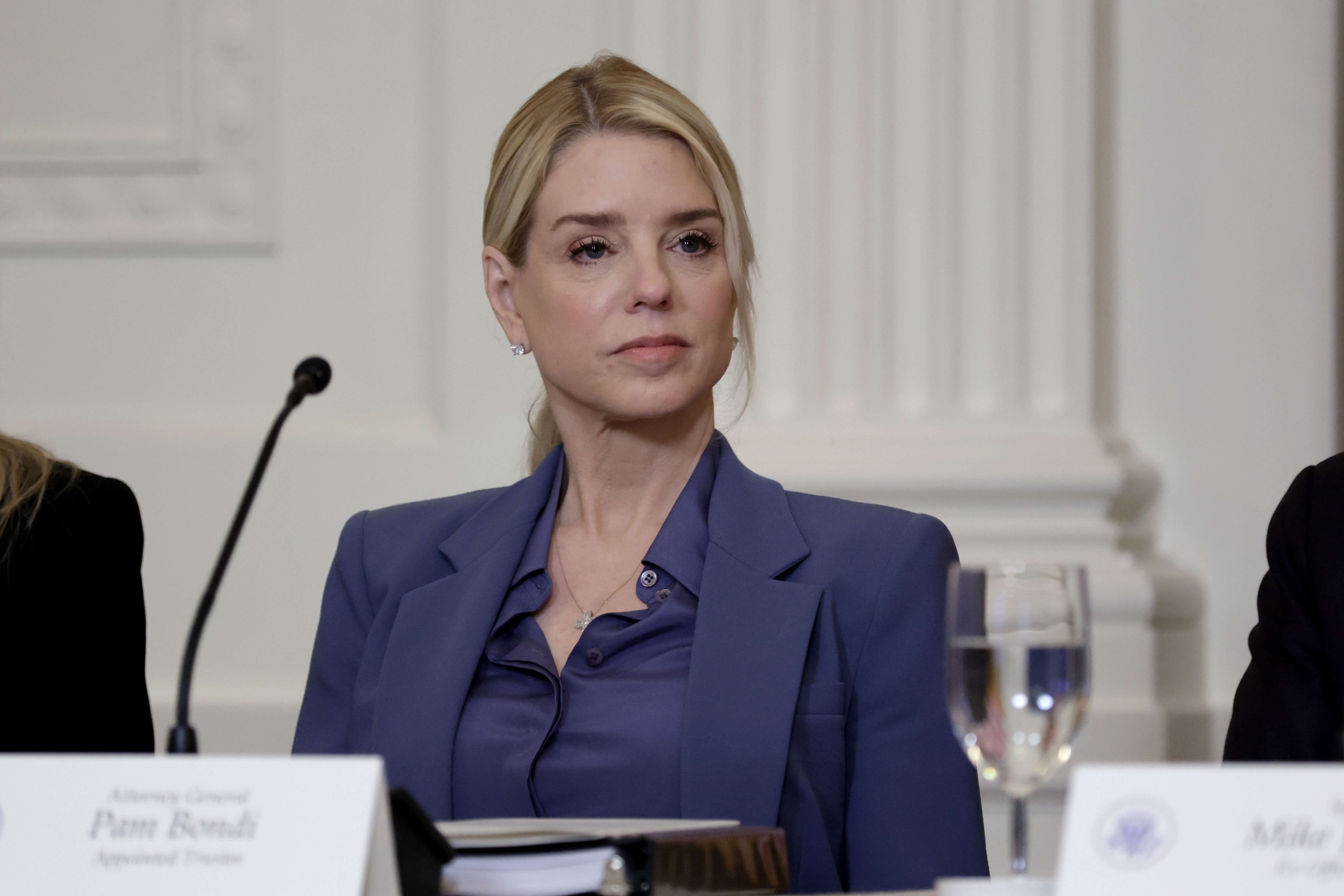 Pam Bondi listens as President Donald Trump speaks during a lunch with the Trump Kennedy Center Board Members in the East Room of the White House in Washington, DC,  on March 16, 2026. | Source: Getty Images