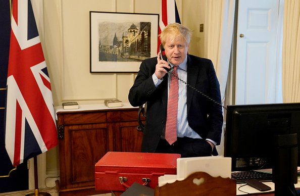Prime Minister Boris Johnson on the telephone to Queen Elizabeth II for her Weekly Audience during the COVID-19 pandemic at 10 Downing Street on March 25, 2020 in London, England | Photo: Getty Images