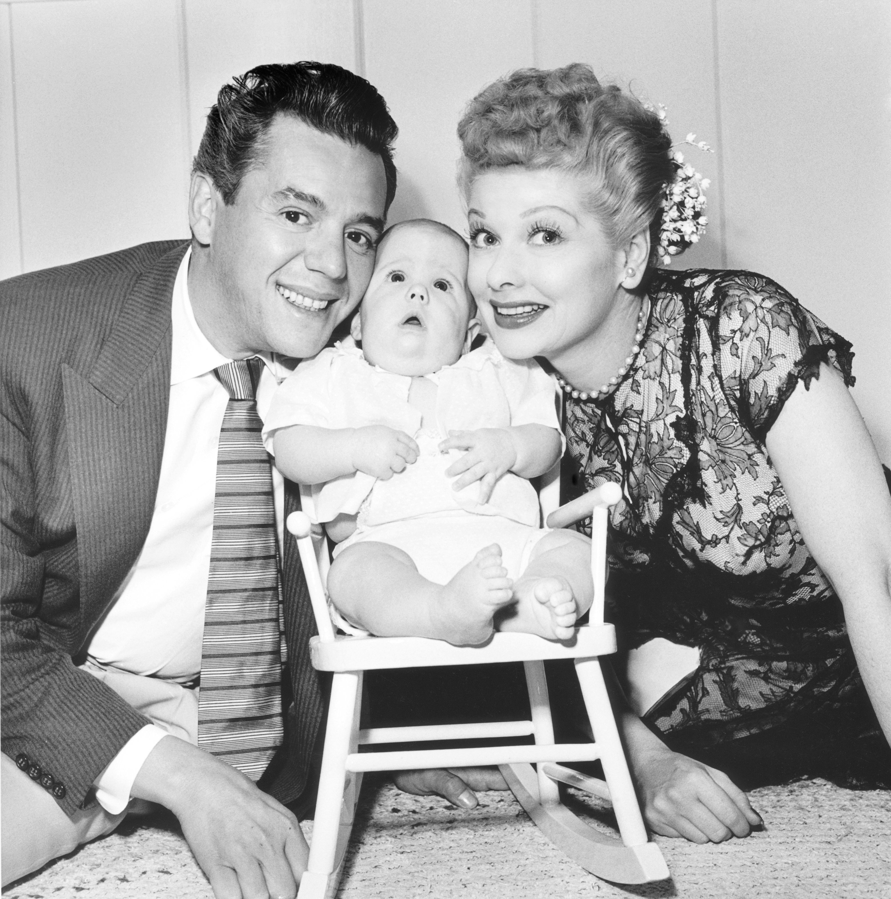 Desi Arnaz and Lucille Ball with their son Desi Arnaz Jr. at their home in California in 1953 | Source: Getty Images