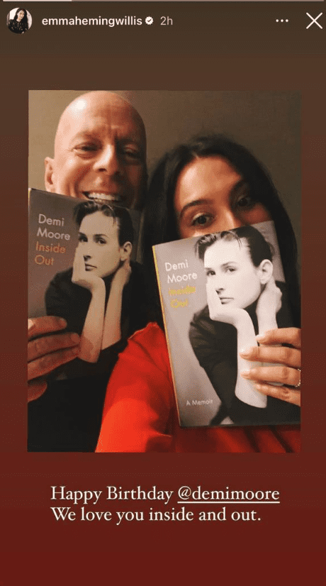 Bruce Willis and Demi Moore pose with Moore's Memoir "Inside Out." as posted on Emma Heming Willis' Instagram story in November 2022 | Source: https://www.instagram.com/emmahemingwillis/ 